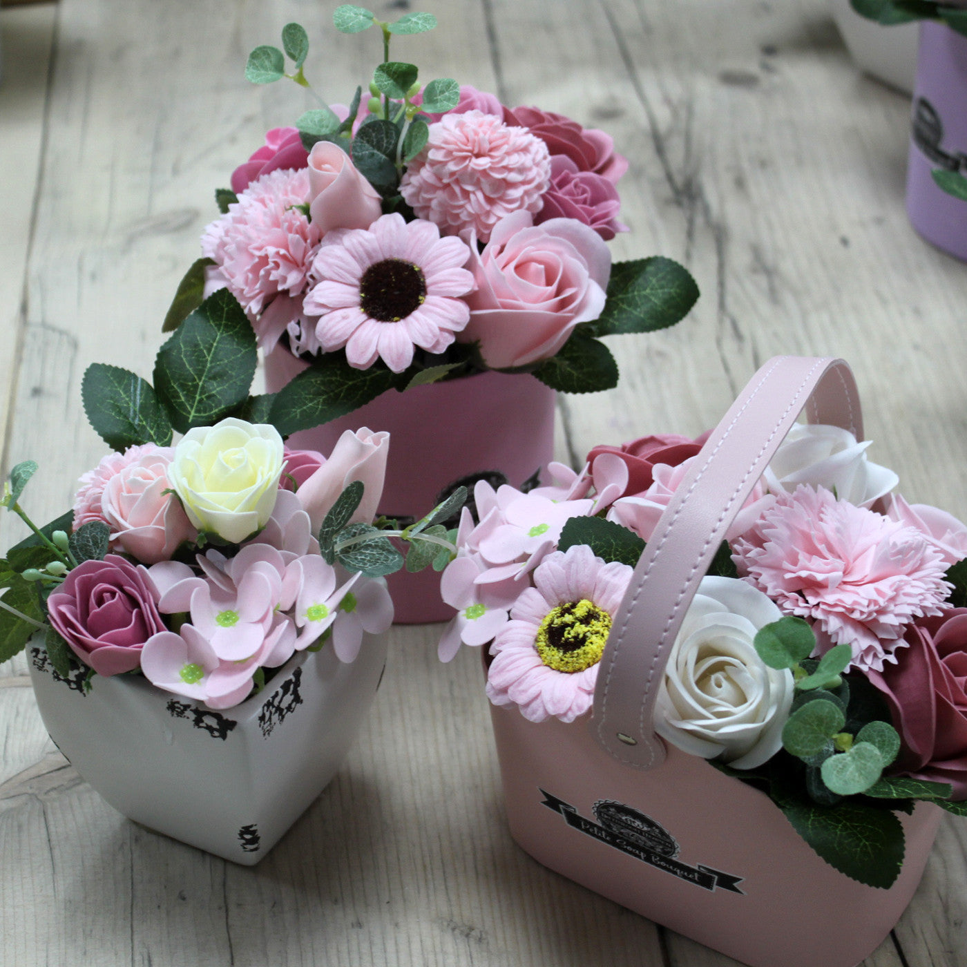 Petite Bouquet Basket - Peaceful Pink, three pink-toned arrangements with white blooms and leafy sprigs, by Quintessential Holistic Health Ltd
