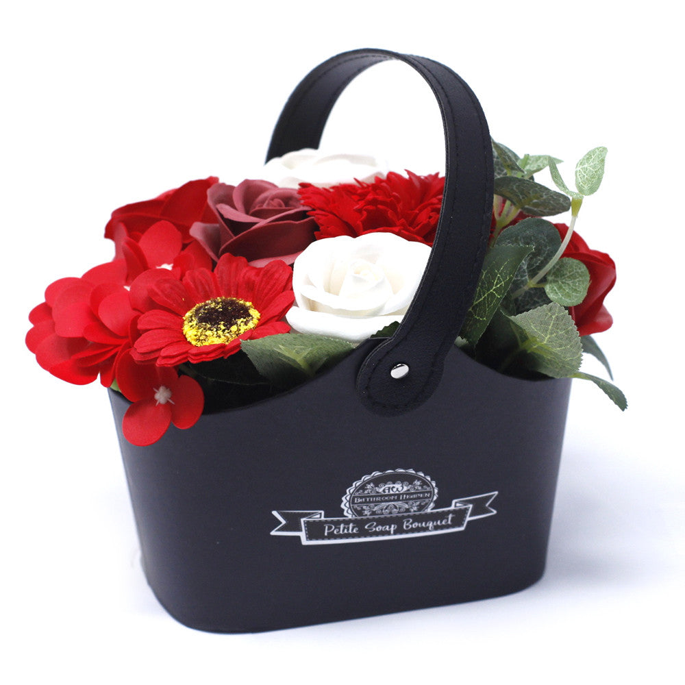 Petite Bouquet Basket - Rich Reds, with red flowers, a white rose and green foliage in a black basket, by Quintessential Holistic Health Ltd