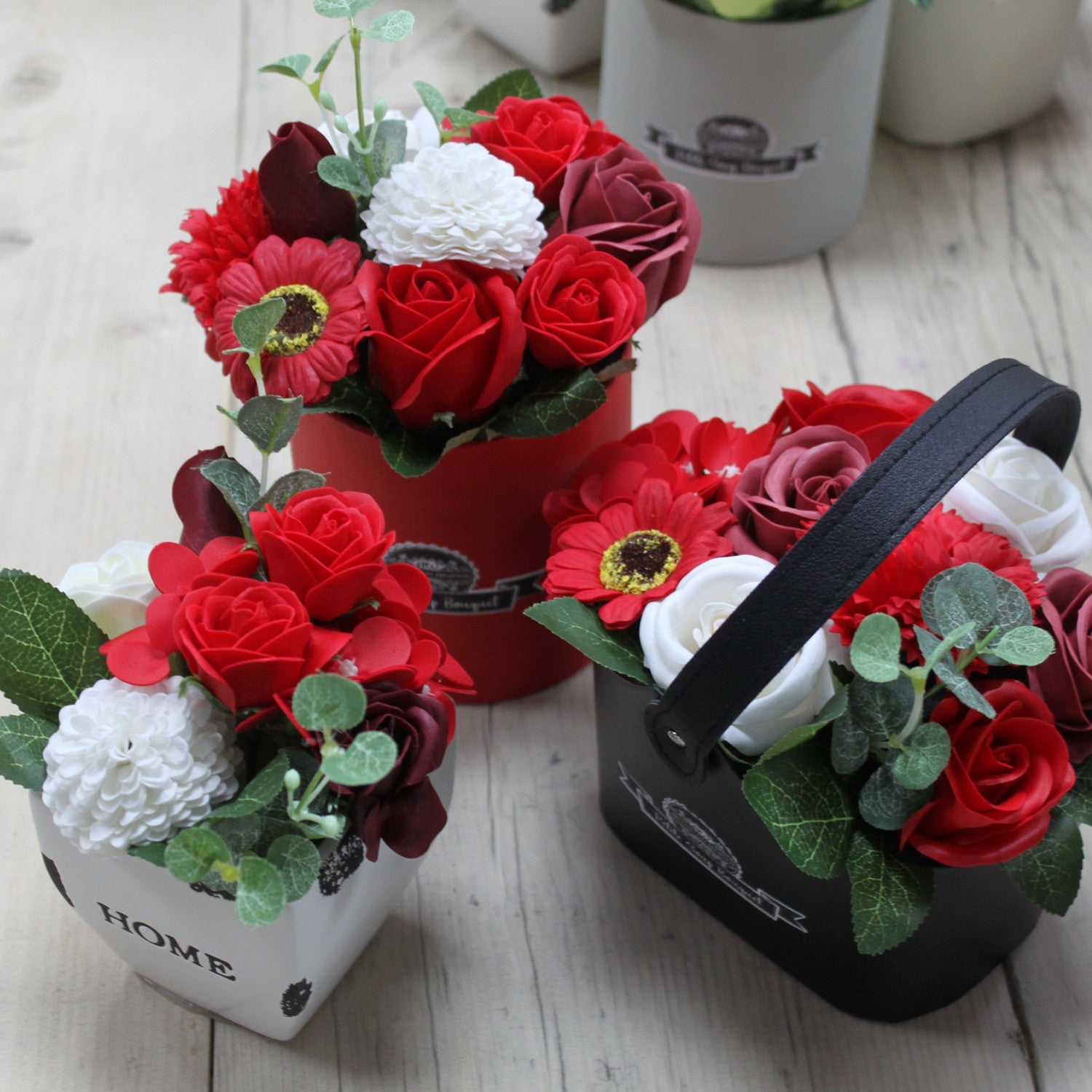 Petite Bouquet Basket - Rich Reds, three arrangements with red roses, white blooms and rounded green leaves, by Quintessential Holistic Health Ltd