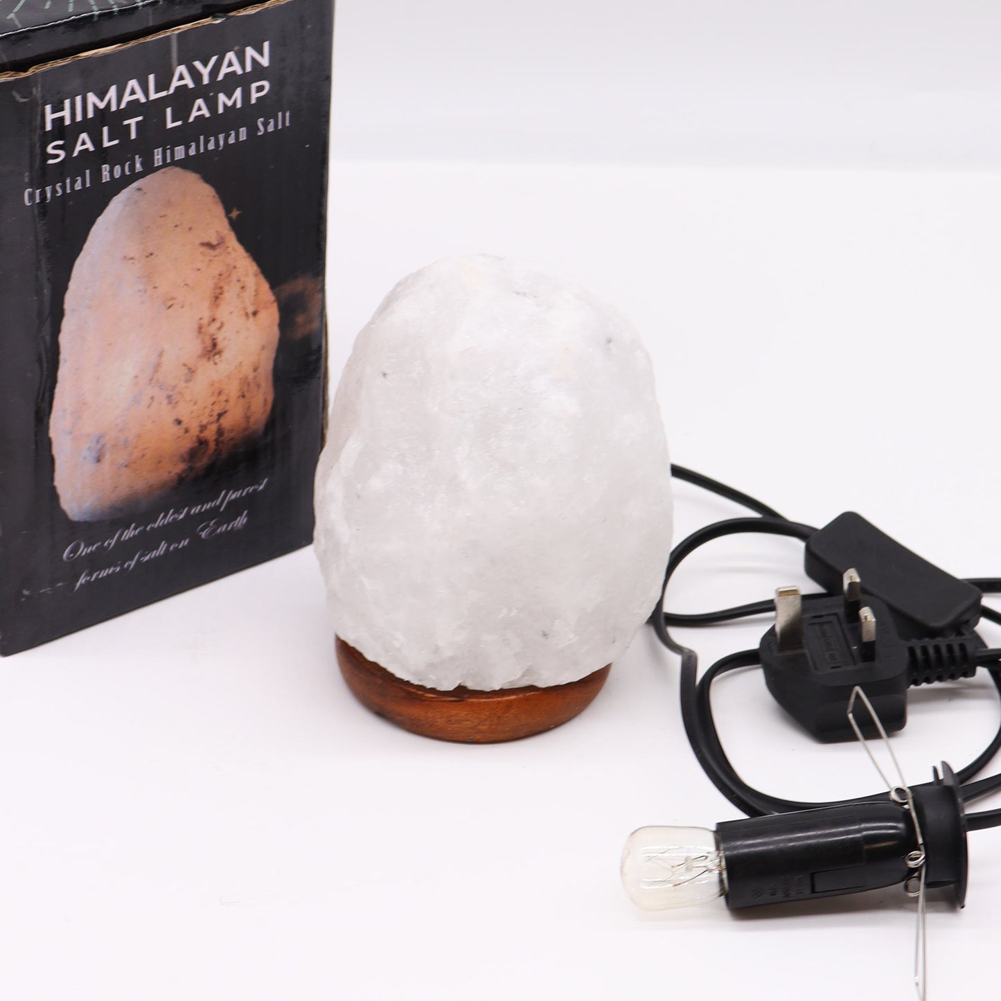 Hand Carved 240v Himalayan Salt Crystal Lamp with Base - White and Natural / 1.5Kg - 2Kg product packaging on clean background from Quintessential Holistic Health Ltd