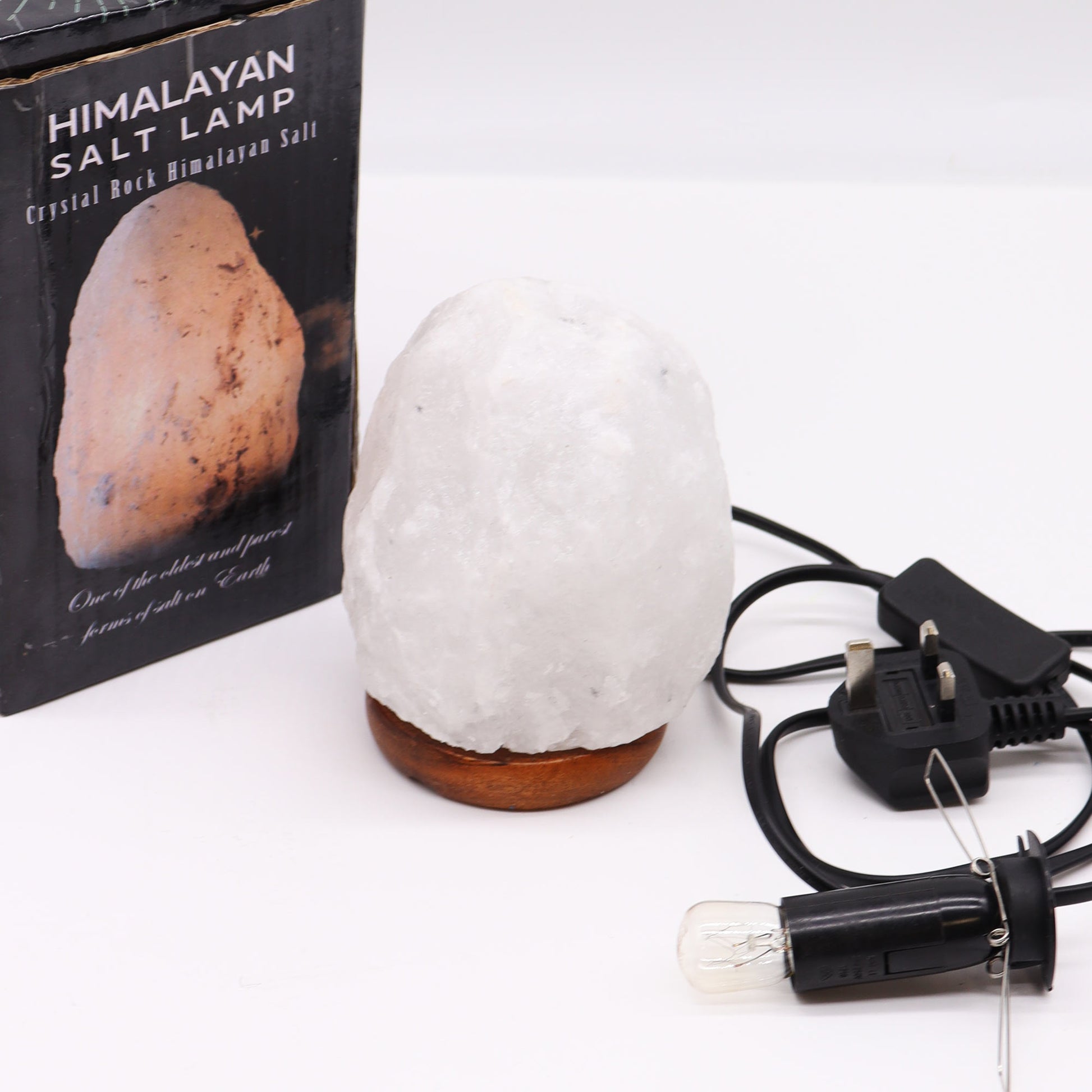 Hand Carved 240v Himalayan Salt Crystal Lamp with Base - White and Natural / 1.5Kg - 2Kg product packaging on clean background from Quintessential Holistic Health Ltd