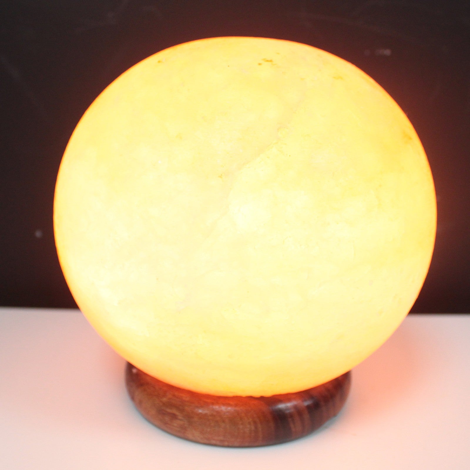 Hand Carved 240v Himalayan Salt Crystal Lamp with Base - Natural / Round / 3.5Kg - 4Kg product packaging on clean background from Quintessential Holistic Health Ltd