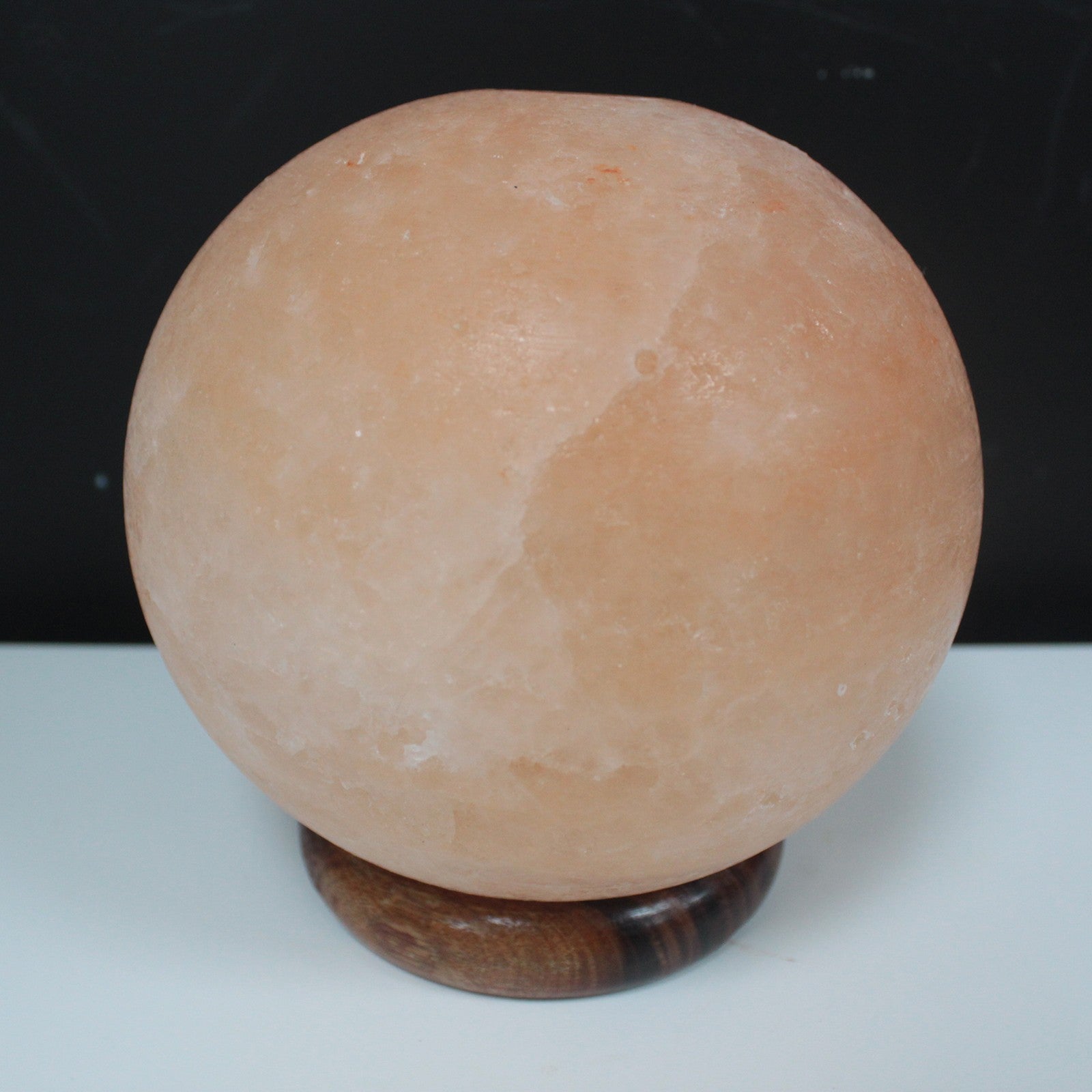 Hand Carved 240v Himalayan Salt Crystal Lamp with Base - Natural / Round / 3.5Kg - 4Kg product packaging on clean background from Quintessential Holistic Health Ltd