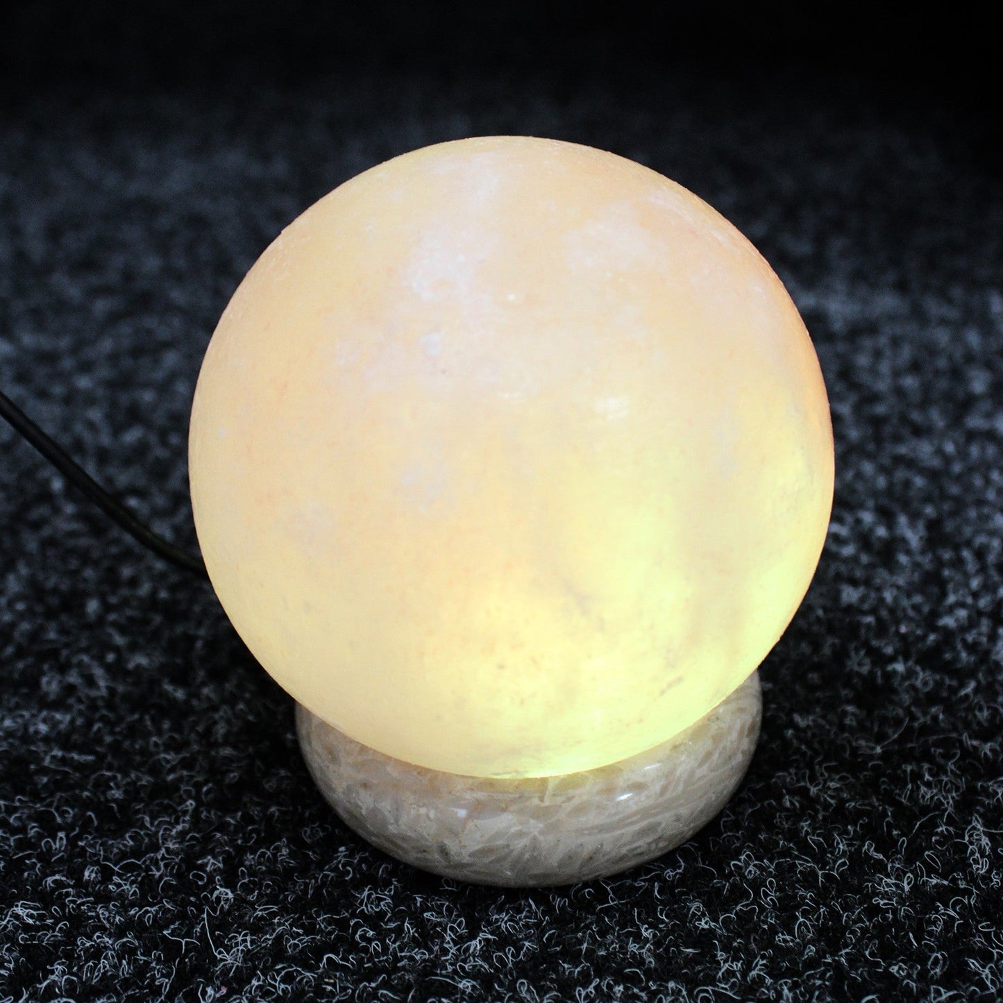 Hand Carved USB Himalayan Salt Crystal Lamp with Base - Natural / Round / Multicoloured Light product packaging on clean background from Quintessential Holistic Health Ltd
