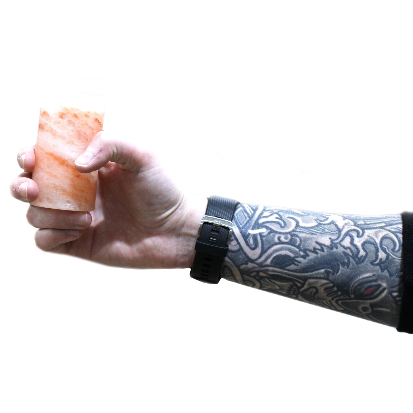 Set of 4 Hand-Carved Himalayan Salt Shot Glasses & Wooden Tray, one pink shot glass held by a tattooed arm by Quintessential Holistic Health Ltd