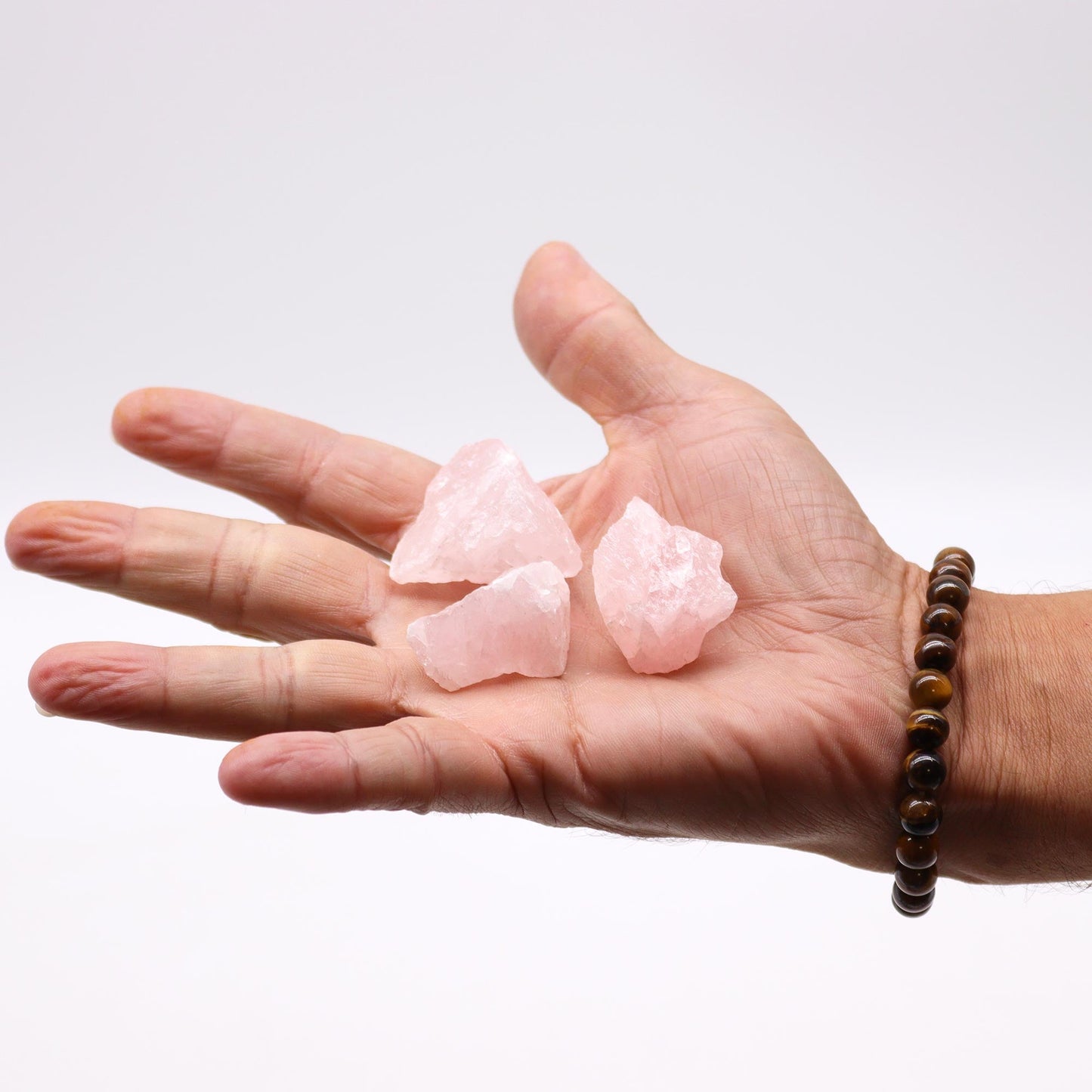 500g Raw Crystals - Rose Quartz product packaging on clean background from Quintessential Holistic Health Ltd