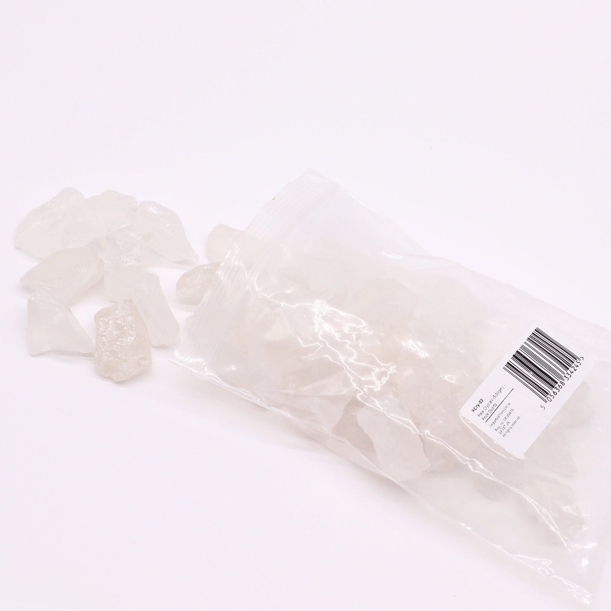 500g Raw Crystals - Rock Quartz product packaging on clean background from Quintessential Holistic Health Ltd