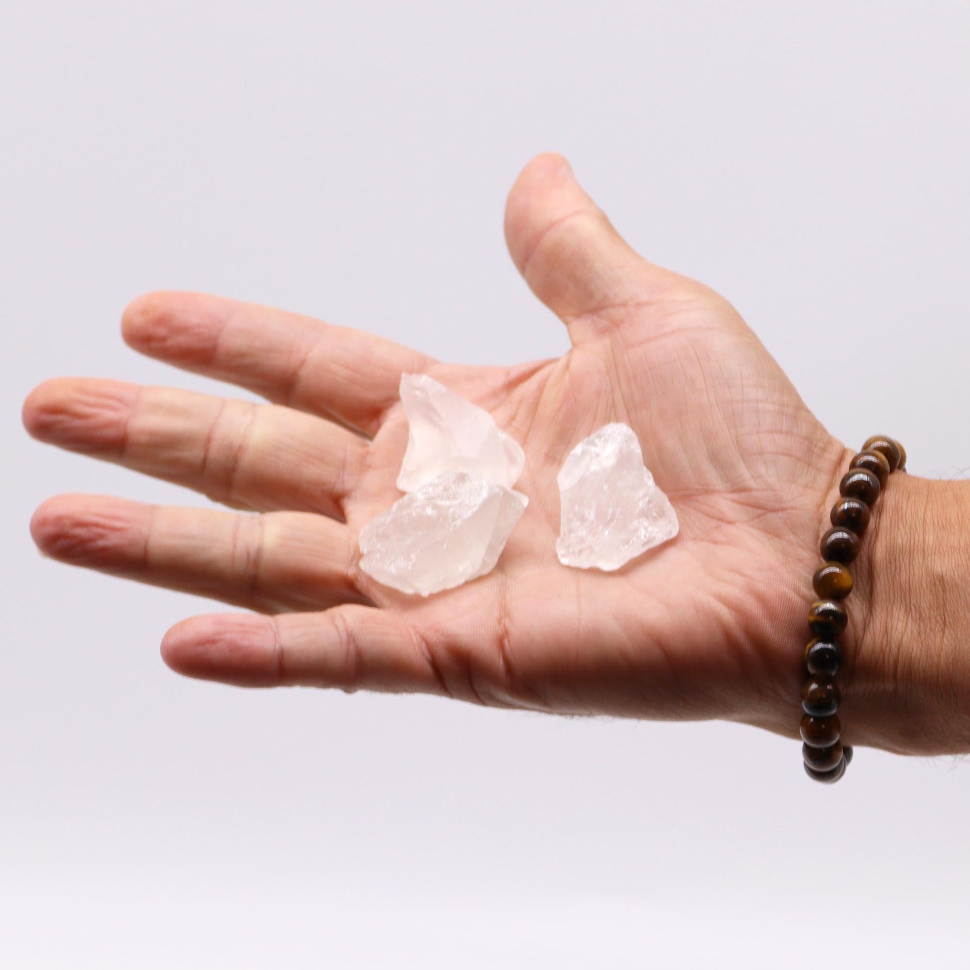 500g Raw Crystals - Rock Quartz product packaging on clean background from Quintessential Holistic Health Ltd