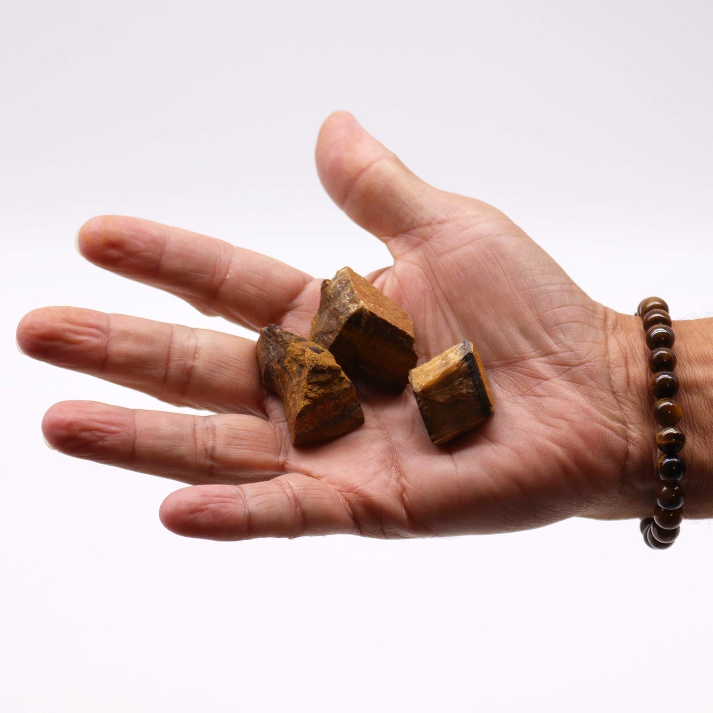 500g Raw Crystals - Tigers Eye product packaging on clean background from Quintessential Holistic Health Ltd