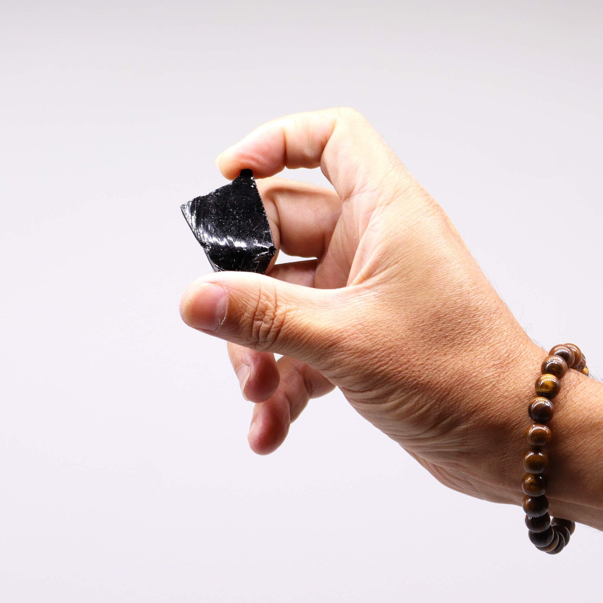 500g Raw Crystals - Black Agate product packaging on clean background from Quintessential Holistic Health Ltd
