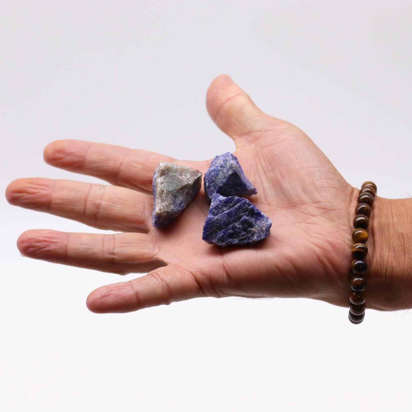 500g Raw Crystals - Sodalite product packaging on clean background from Quintessential Holistic Health Ltd
