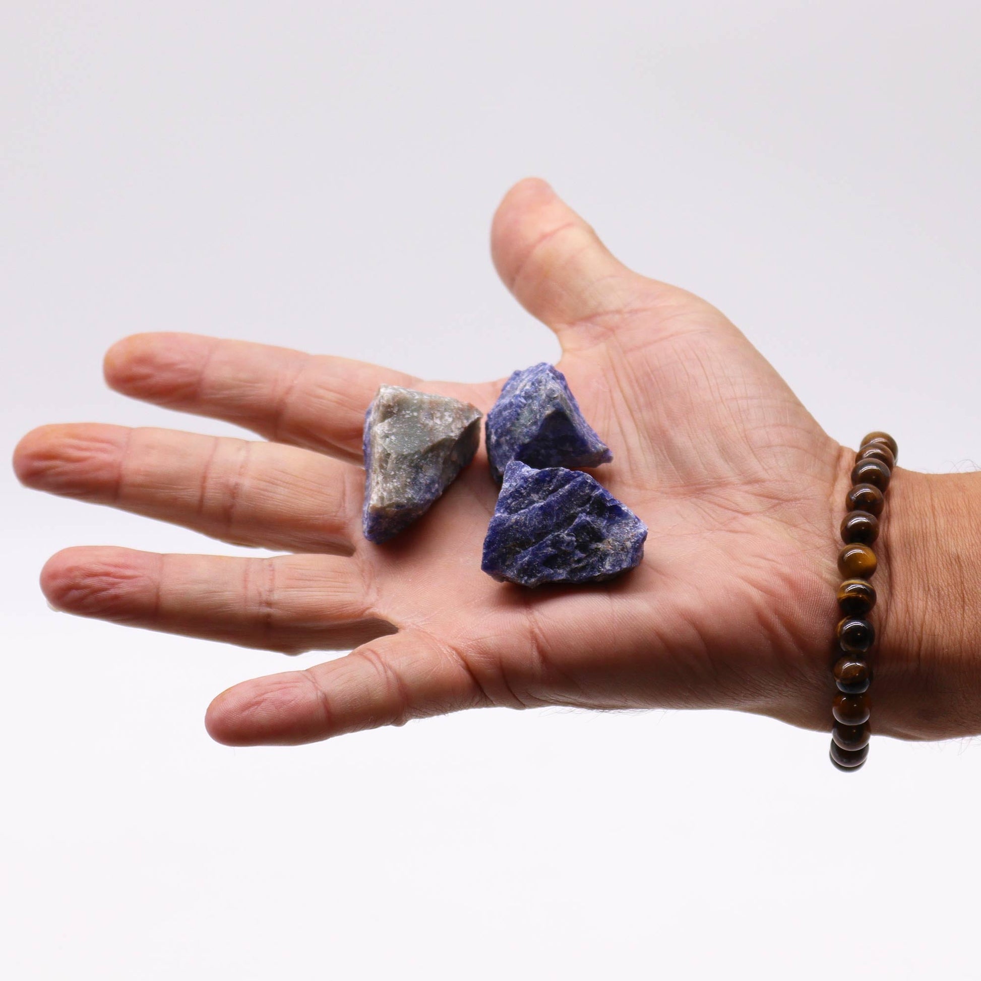 500g Raw Crystals - Sodalite product packaging on clean background from Quintessential Holistic Health Ltd
