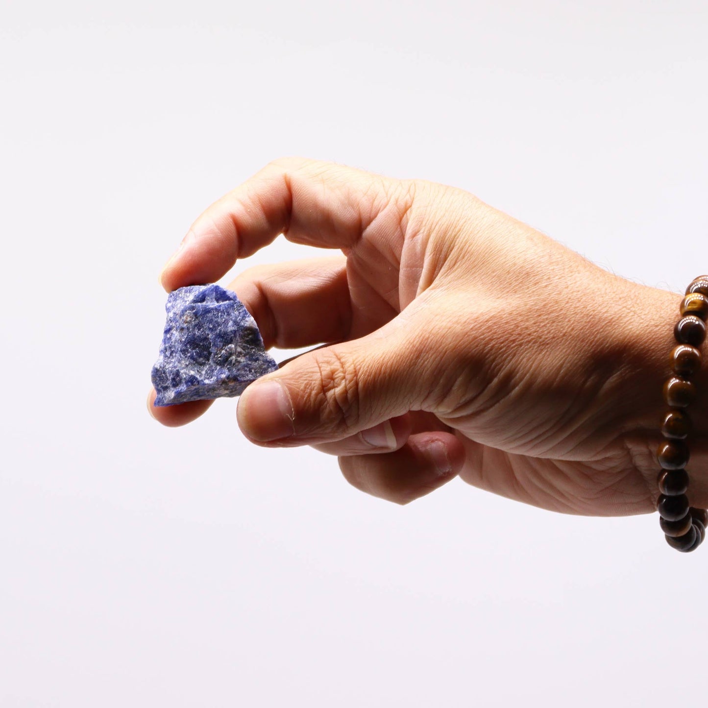 500g Raw Crystals - Sodalite product packaging on clean background from Quintessential Holistic Health Ltd