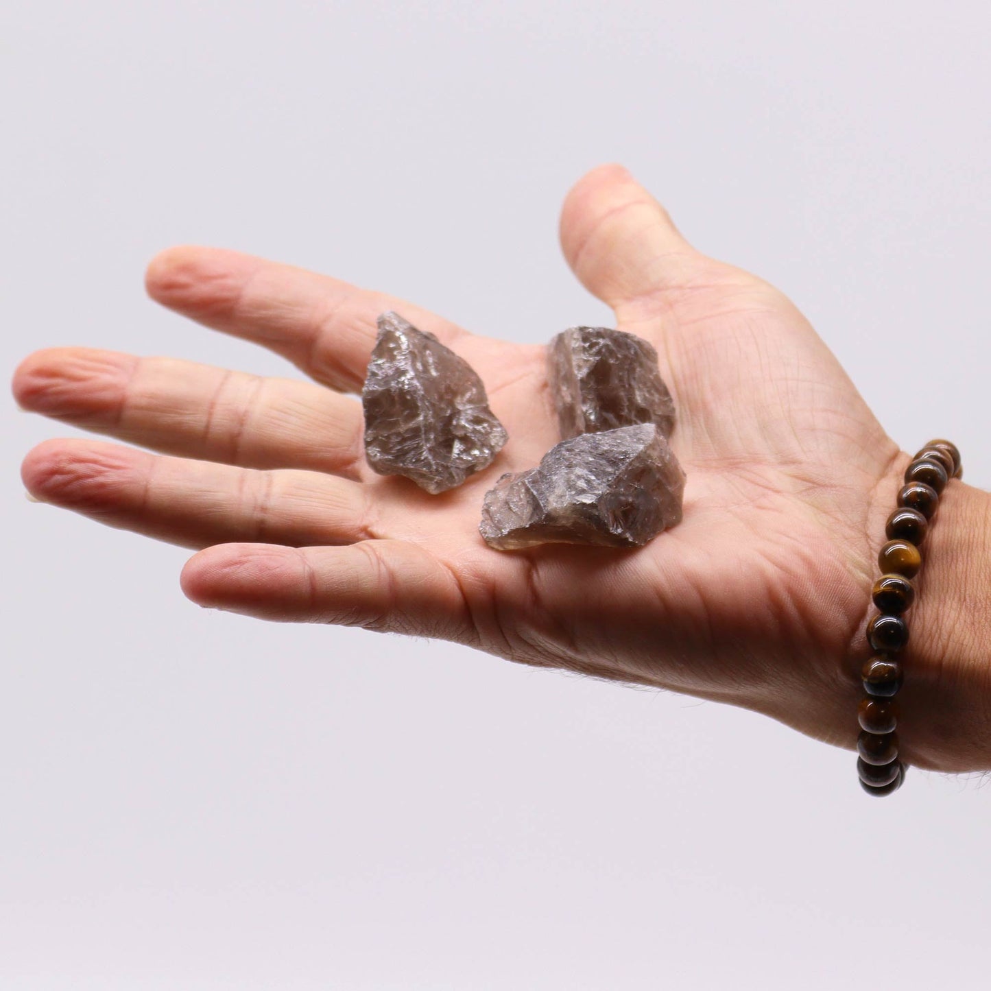 500g Raw Crystals - Smoky Quartz product packaging on clean background from Quintessential Holistic Health Ltd