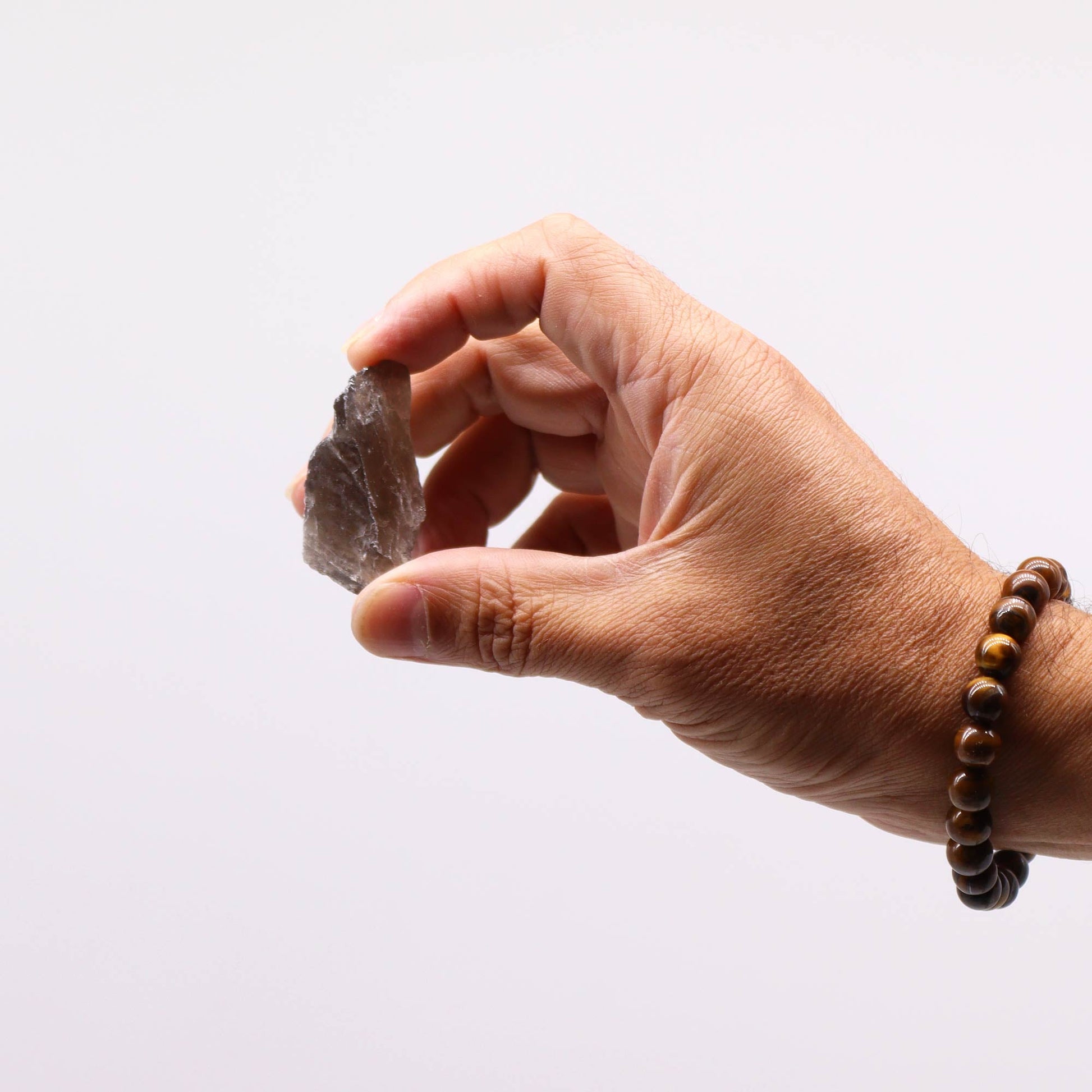 500g Raw Crystals - Smoky Quartz product packaging on clean background from Quintessential Holistic Health Ltd
