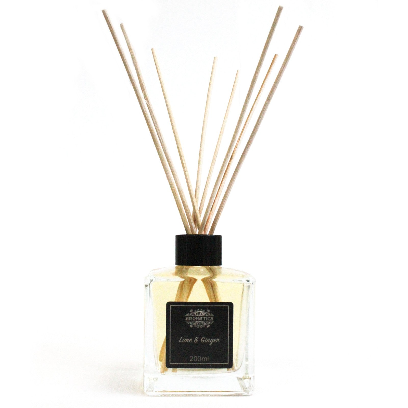 Reed Diffuser - Lime and Ginger - 200ml, clear square bottle with pale liquid, black cap and fanned reeds by Quintessential Holistic Health Ltd