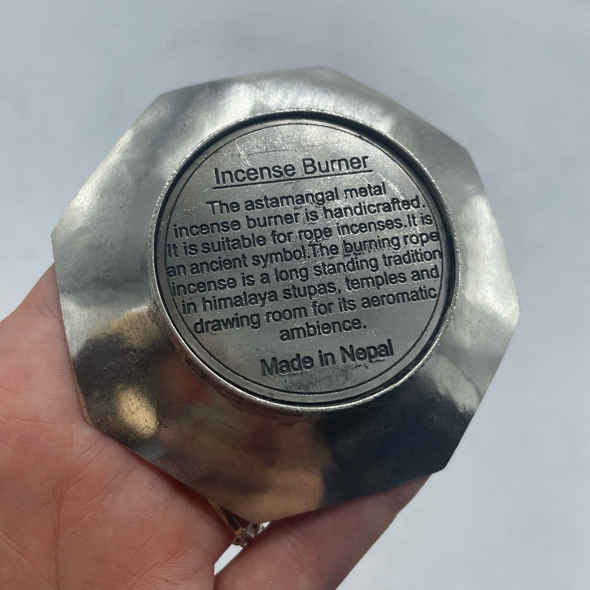 Rope Incense and Silver Plated Holder Set - Astamangal showing a circular text label beneath the scalloped octagonal holder by Quintessential Holistic Health Ltd
