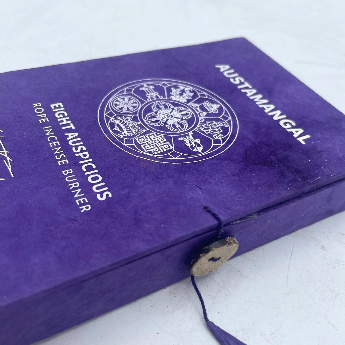 Rope Incense and Silver Plated Holder Set - Astamangal with white mandala design, lettering and a button tie on a purple cover by Quintessential Holistic Health Ltd