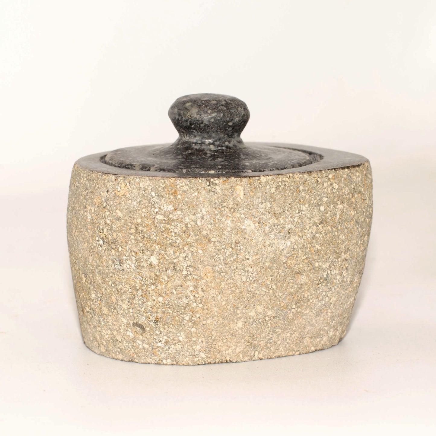 Hand Carved Natural River Stone Grounding Pot - Small product packaging on clean background from Quintessential Holistic Health Ltd
