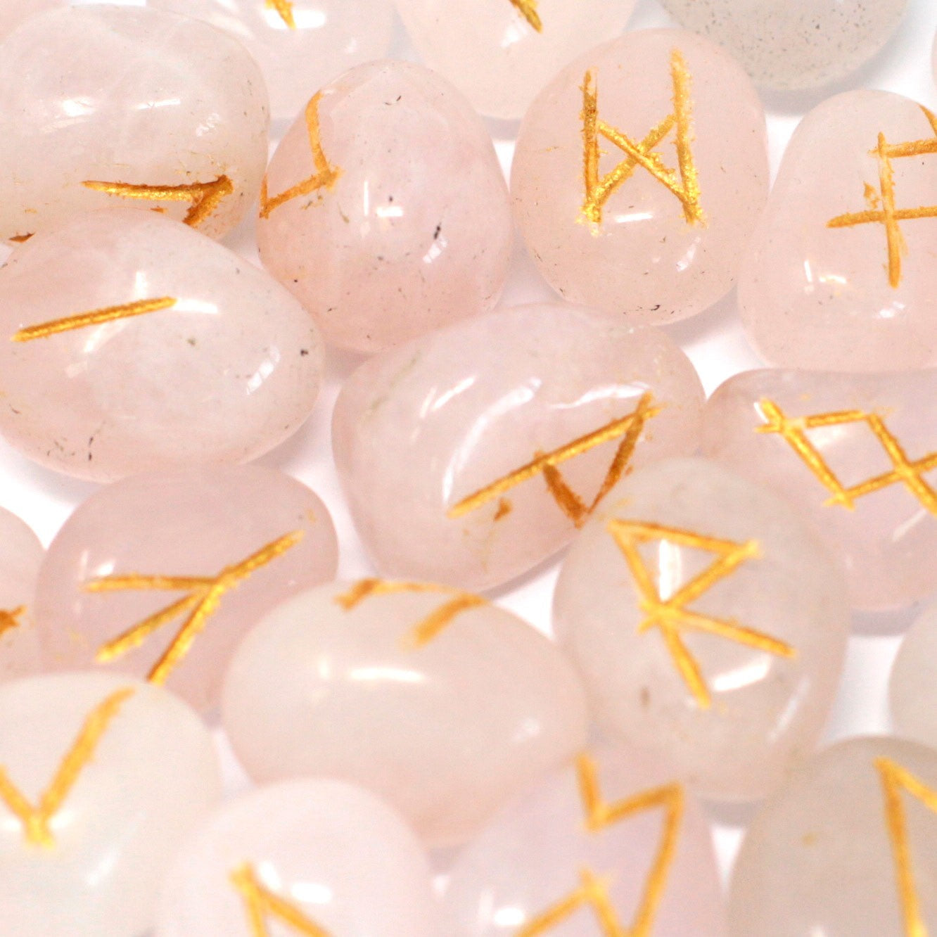 Rune Stone Set in a Pouch - Rose Quartz Gemstones product packaging on clean background from Quintessential Holistic Health Ltd