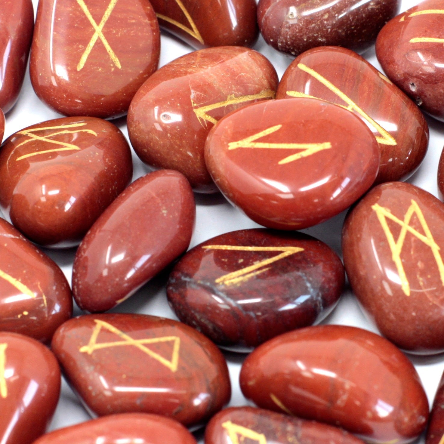Rune Stone Set in a Pouch - Red Jasper Gemstones product packaging on clean background from Quintessential Holistic Health Ltd