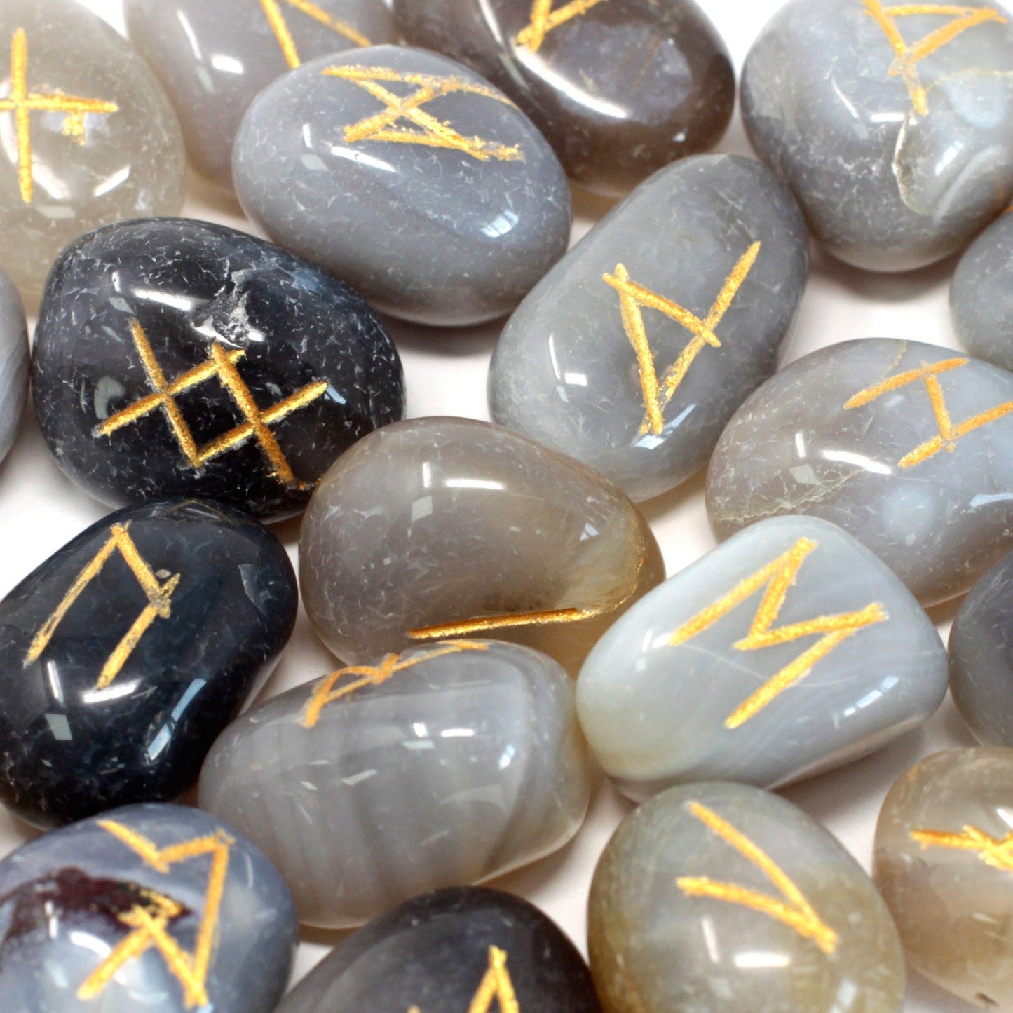 Rune Stone Set in a Pouch - Grey Agate Gemstones product packaging on clean background from Quintessential Holistic Health Ltd