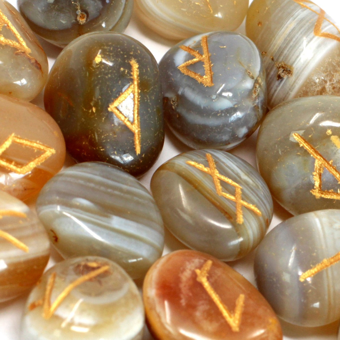 Rune Stone Set in a Pouch - Banded Agate Gemstones product packaging on clean background from Quintessential Holistic Health Ltd