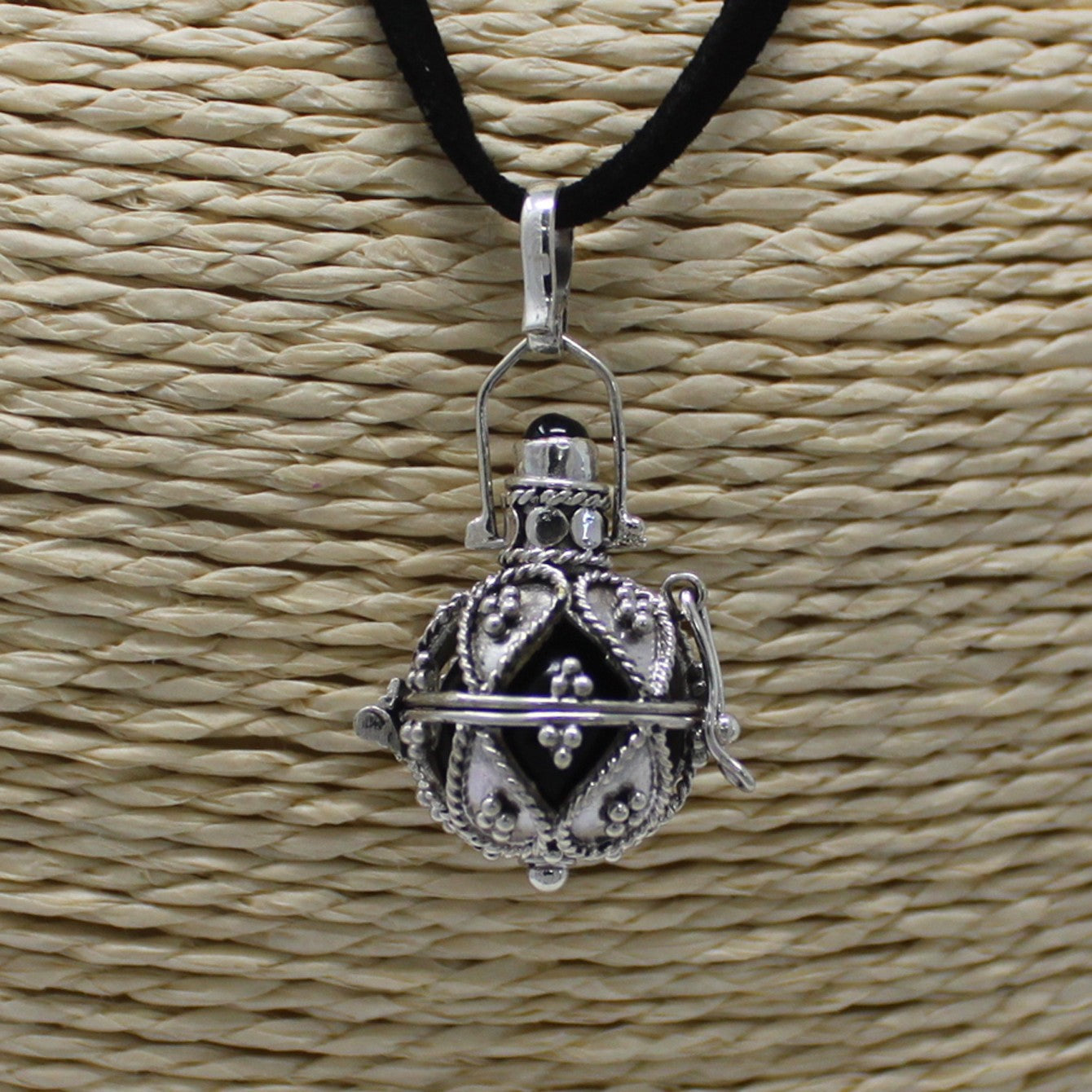 Handmade 925 Silver Angel Bell Pendant Necklace - 16mm / Darkness product packaging on clean background from Quintessential Holistic Health Ltd