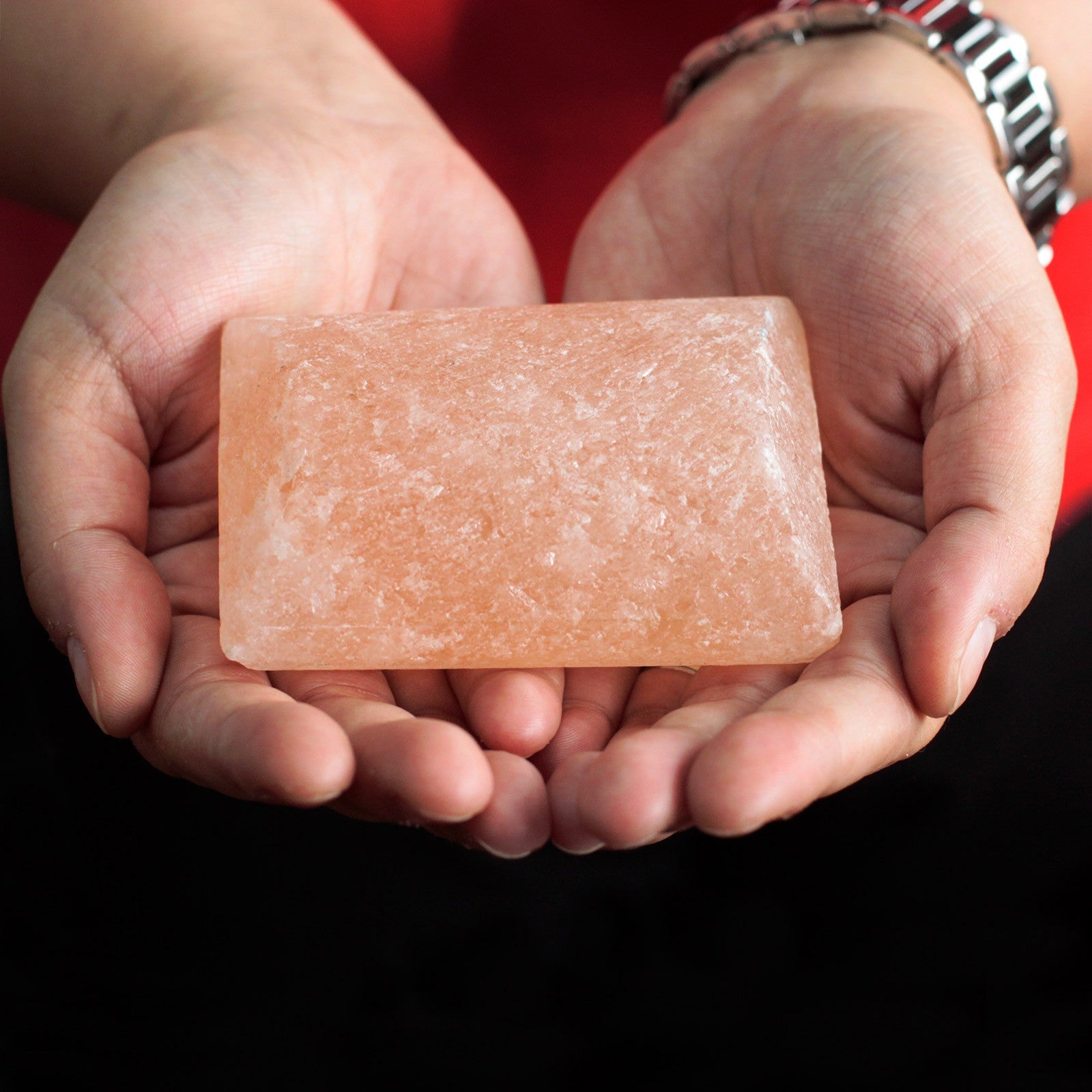 Himalayan Mineral Salt Deodorant and Massage Stones - 1 Pack - Bar, orange-pink rectangular bar held in two hands by Quintessential Holistic Health Ltd