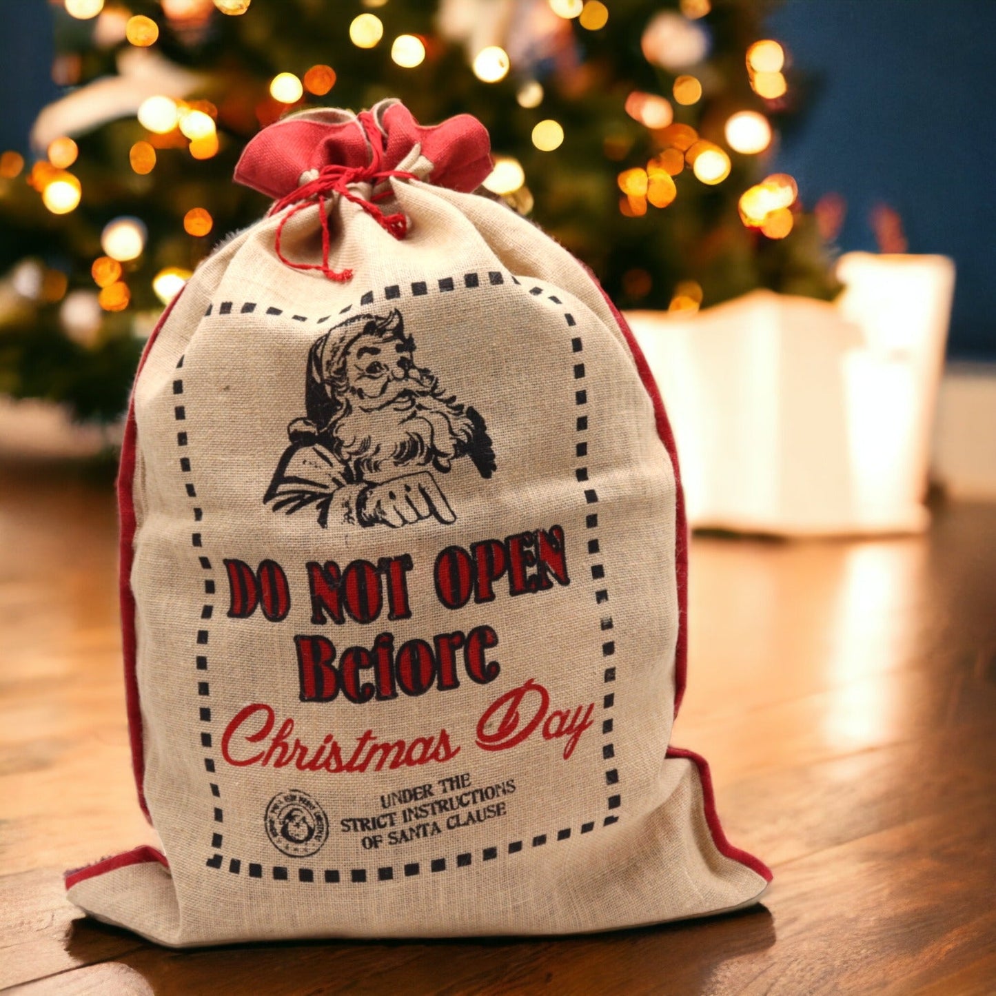 Eco-Friendly Re-Usable Jute Christmas Santa Sack - Do Not Open Before product packaging on clean background from Quintessential Holistic Health Ltd