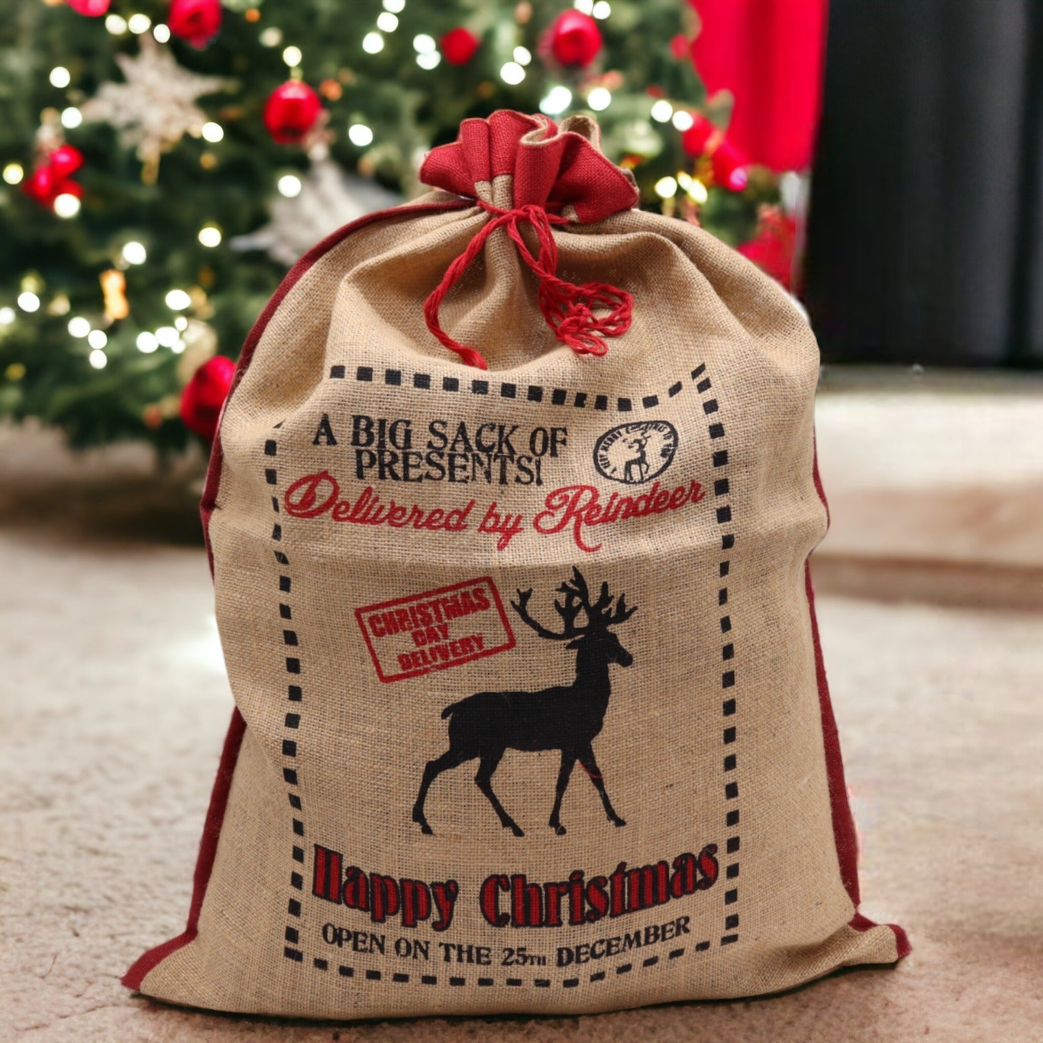 Eco-Friendly Re-Usable Jute Christmas Santa Sack - Delivered by Reindeer product packaging on clean background from Quintessential Holistic Health Ltd
