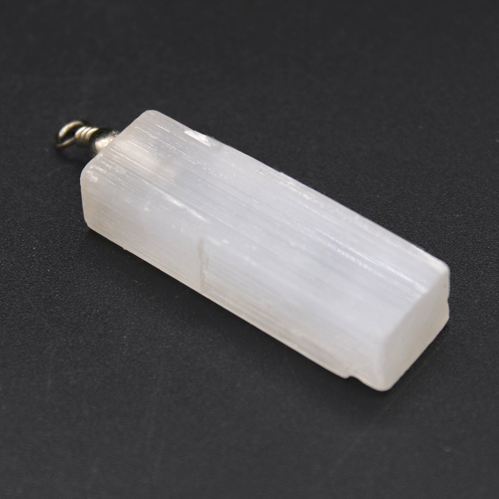 Selenite Natural Pendant product packaging on clean background from Quintessential Holistic Health Ltd
