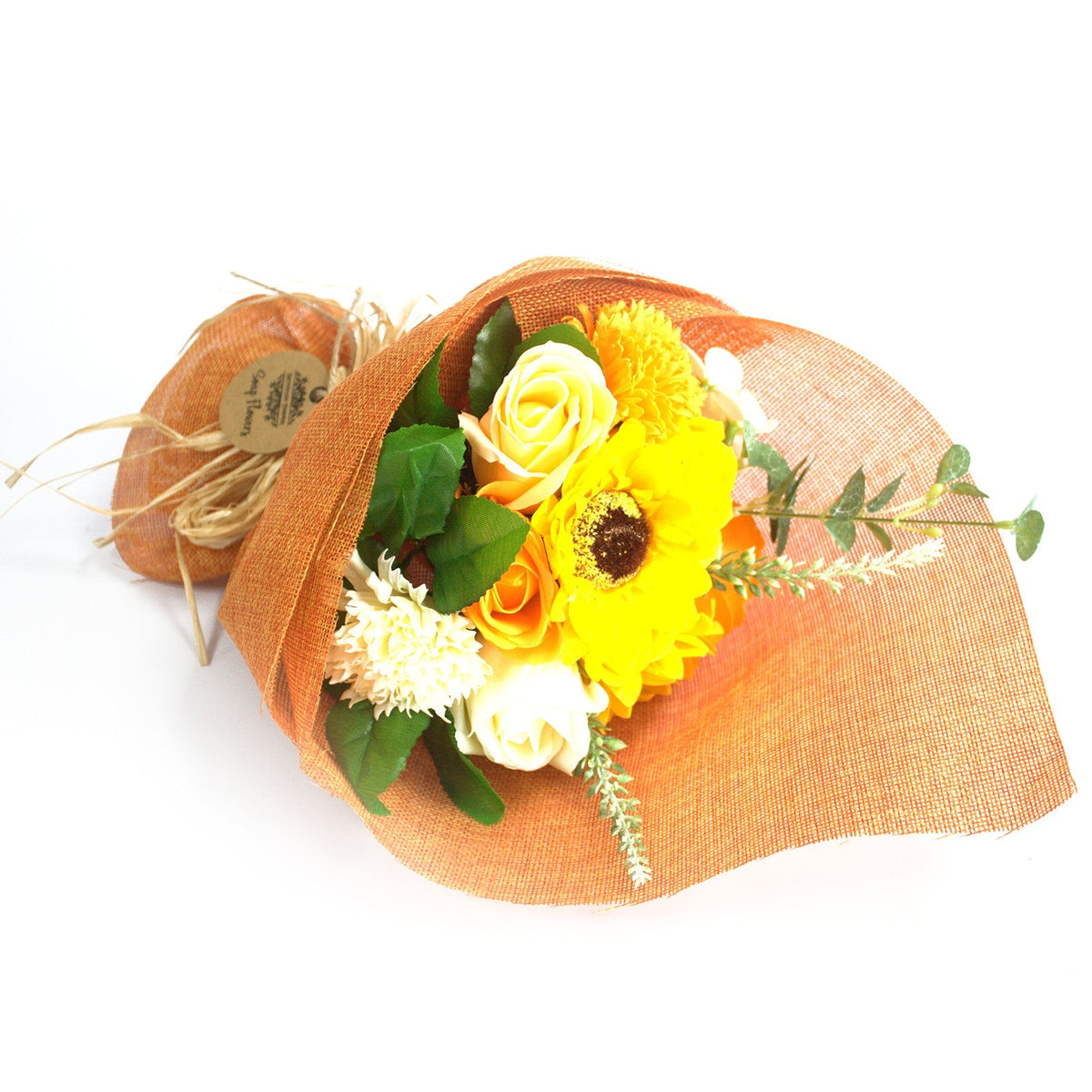 Standing Soap Flower Bouquet - Orange, laid on its side with yellow and orange flowers and leafy sprigs, by Quintessential Holistic Health Ltd
