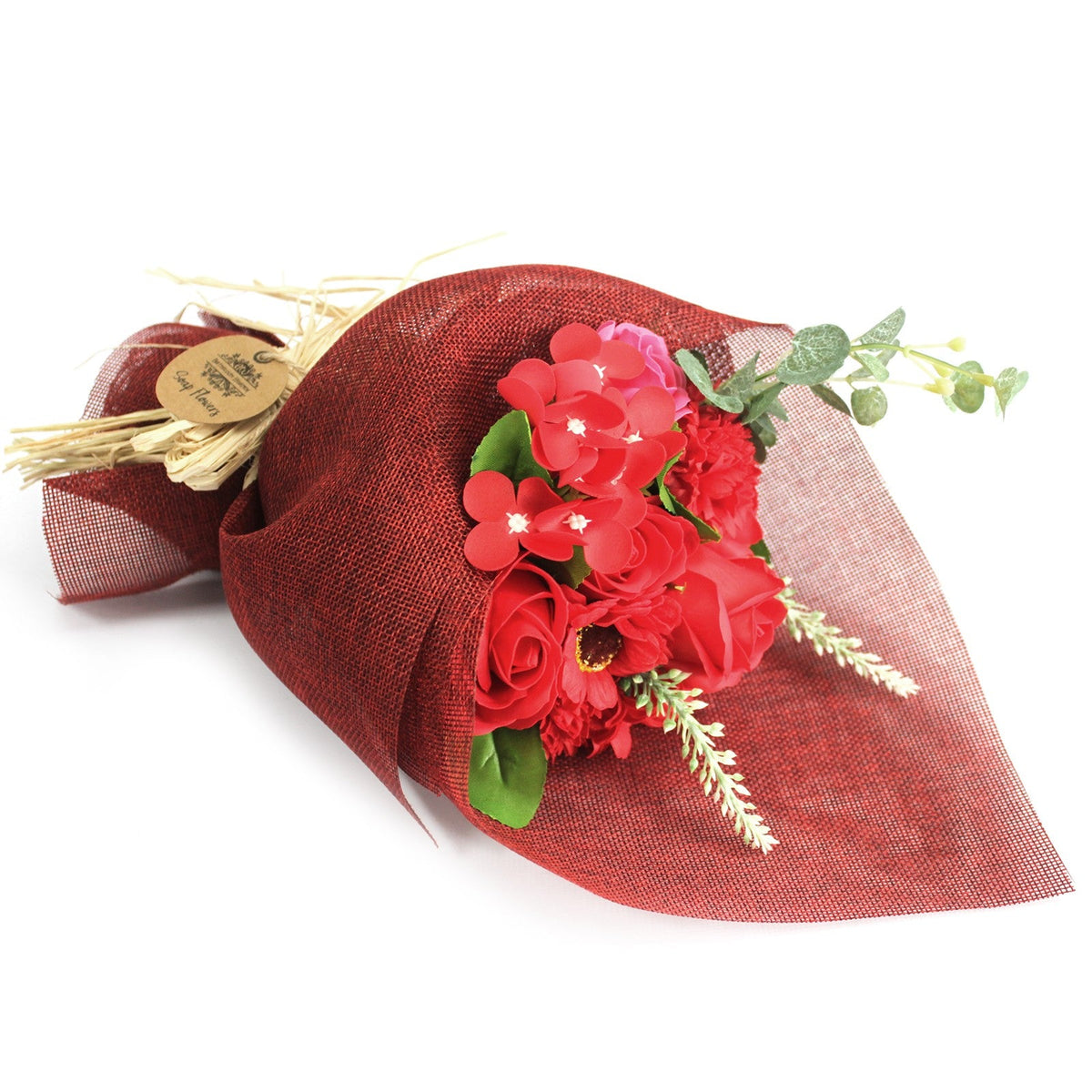 Standing Soap Flower Bouquet - Red, laid on its side with red flowers and green foliage in burgundy wrapping, by Quintessential Holistic Health Ltd