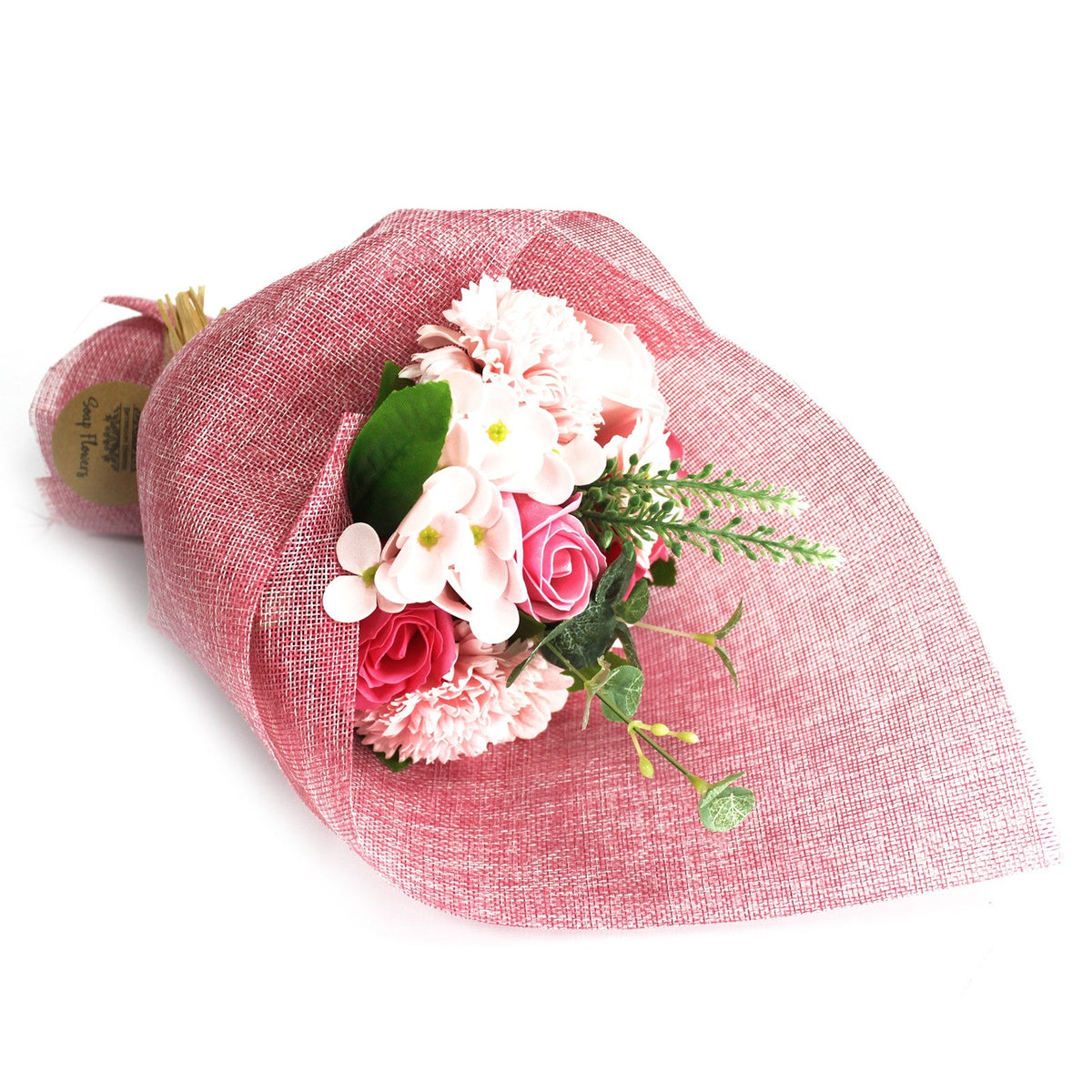 Standing Soap Flower Bouquet - Pink, laid on its side with white and pink flowers in rose-pink wrapping, by Quintessential Holistic Health Ltd