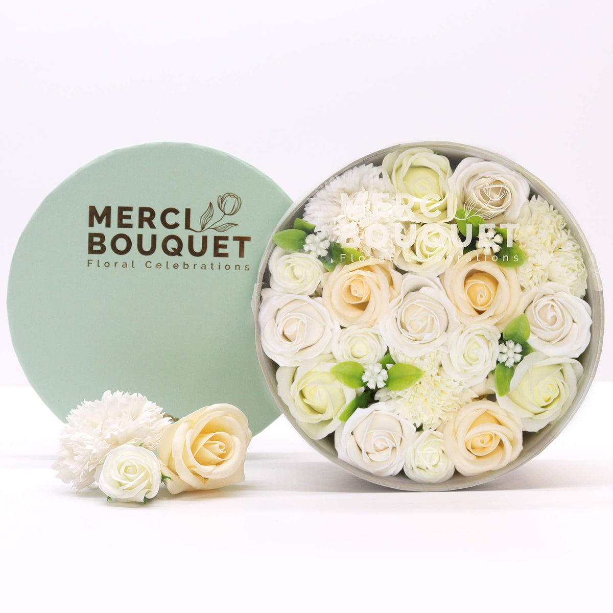 Luxury Soap Flowers - Round - Whites and Ivory, cream and white floral display beside a mint-green branded lid and loose blooms, by Quintessential Holistic Health Ltd