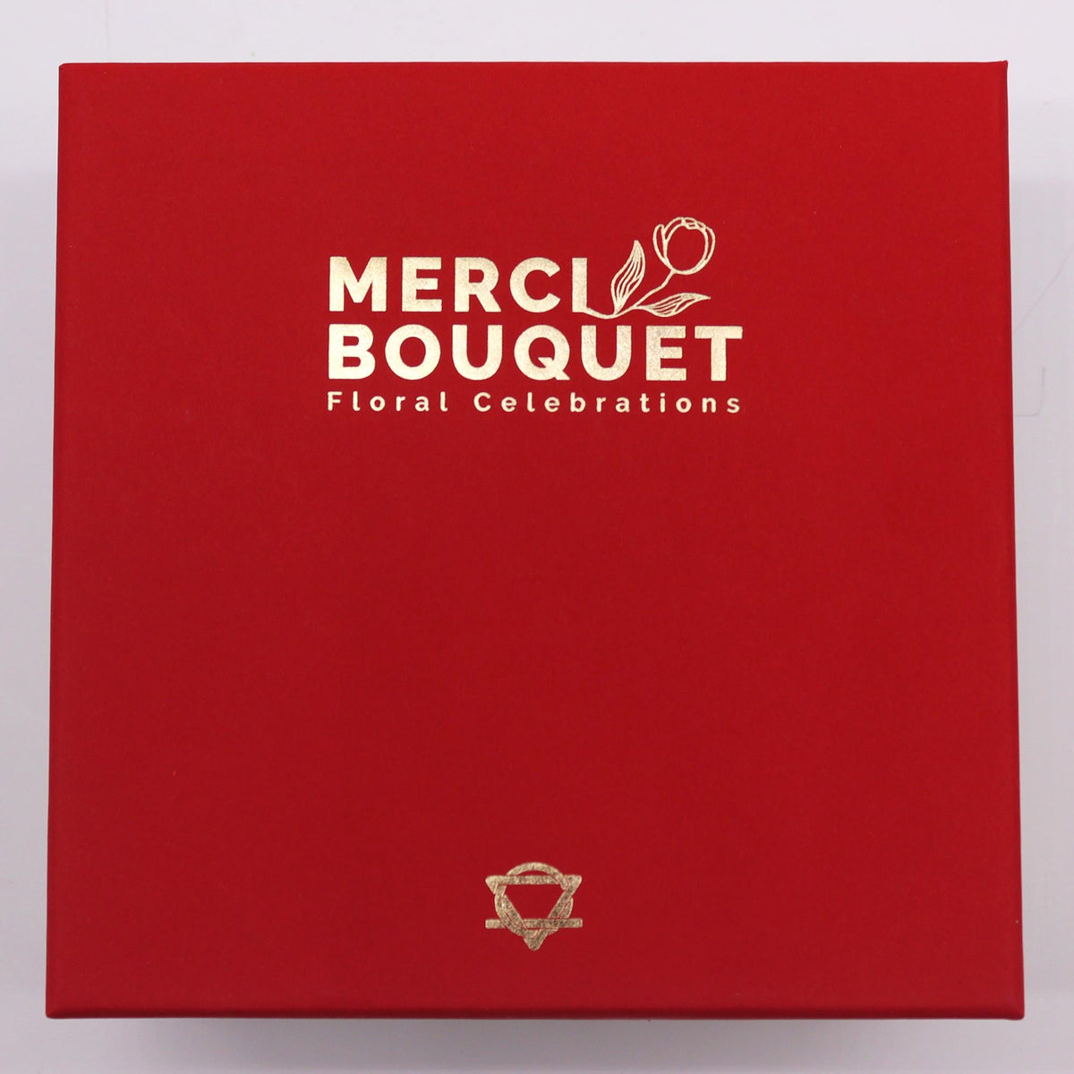Luxury Soap Flowers - Square - Vintage Reds in a closed red box with gold Merci Bouquet branding by Quintessential Holistic Health Ltd