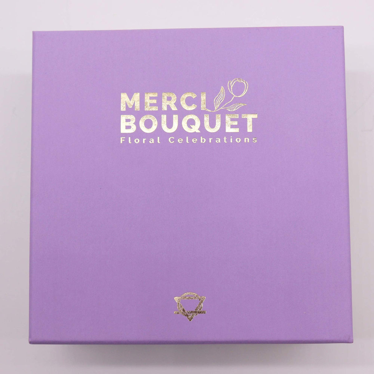 Luxury Soap Flowers - Square - Purples in a closed lilac box with gold Merci Bouquet branding by Quintessential Holistic Health Ltd