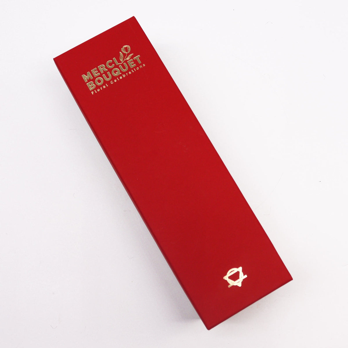 Luxury Soap Flowers - Long - Vintage Reds, shown as a closed deep red rectangular box with gold lettering and emblem, by Quintessential Holistic Health Ltd