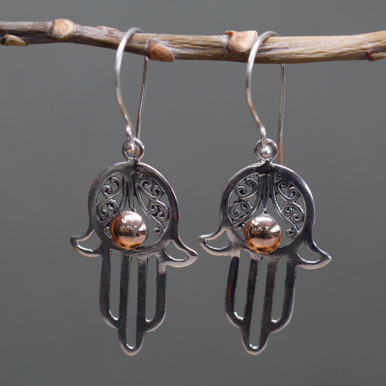 Handmade 18k Gold and 925 Silver Earrings - Hamsa product packaging on clean background from Quintessential Holistic Health Ltd