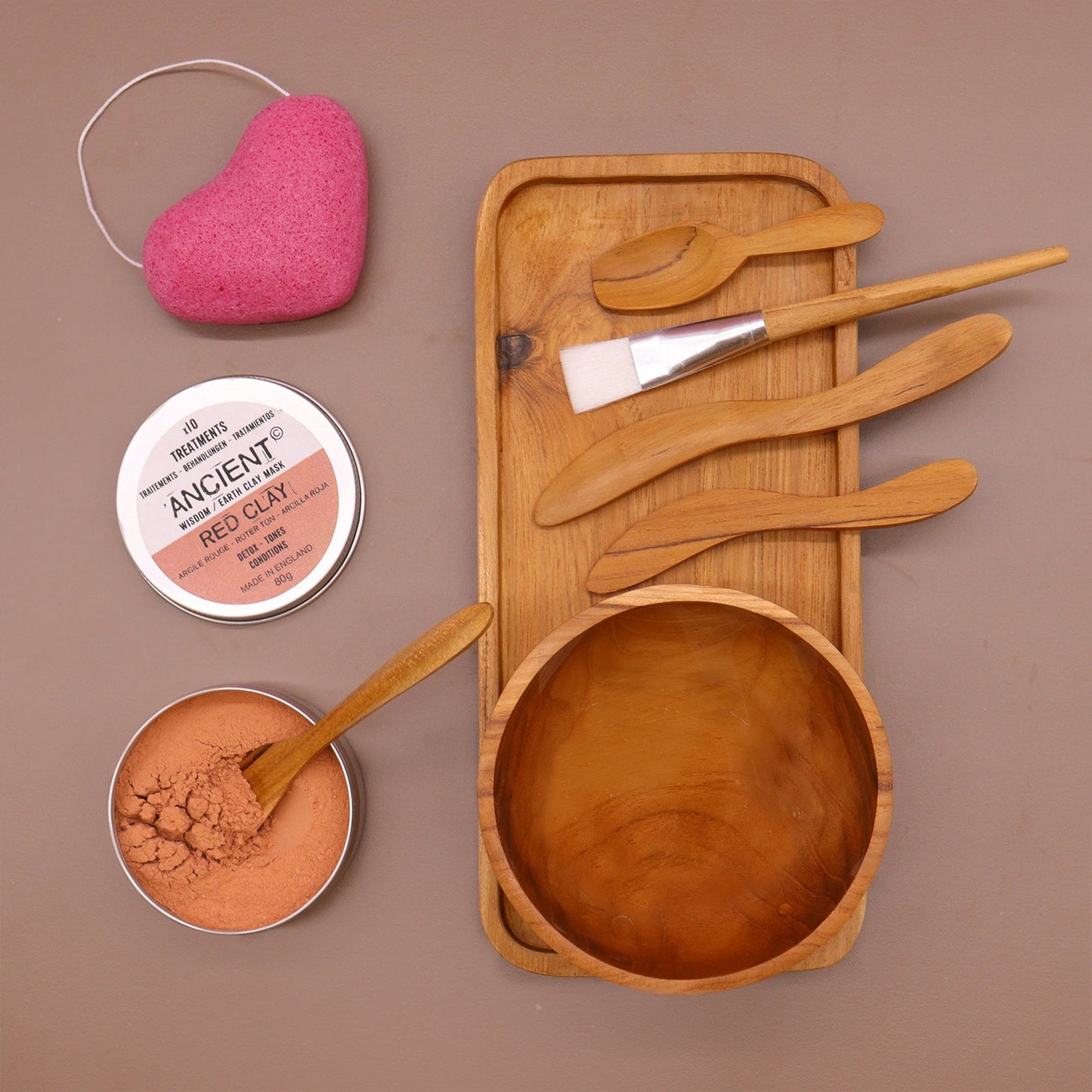 Handmade Teak Clay or Wax Spa Application Set with empty bowl, brushes and applicators beside two open tins and a pink sponge by Quintessential Holistic Health Ltd