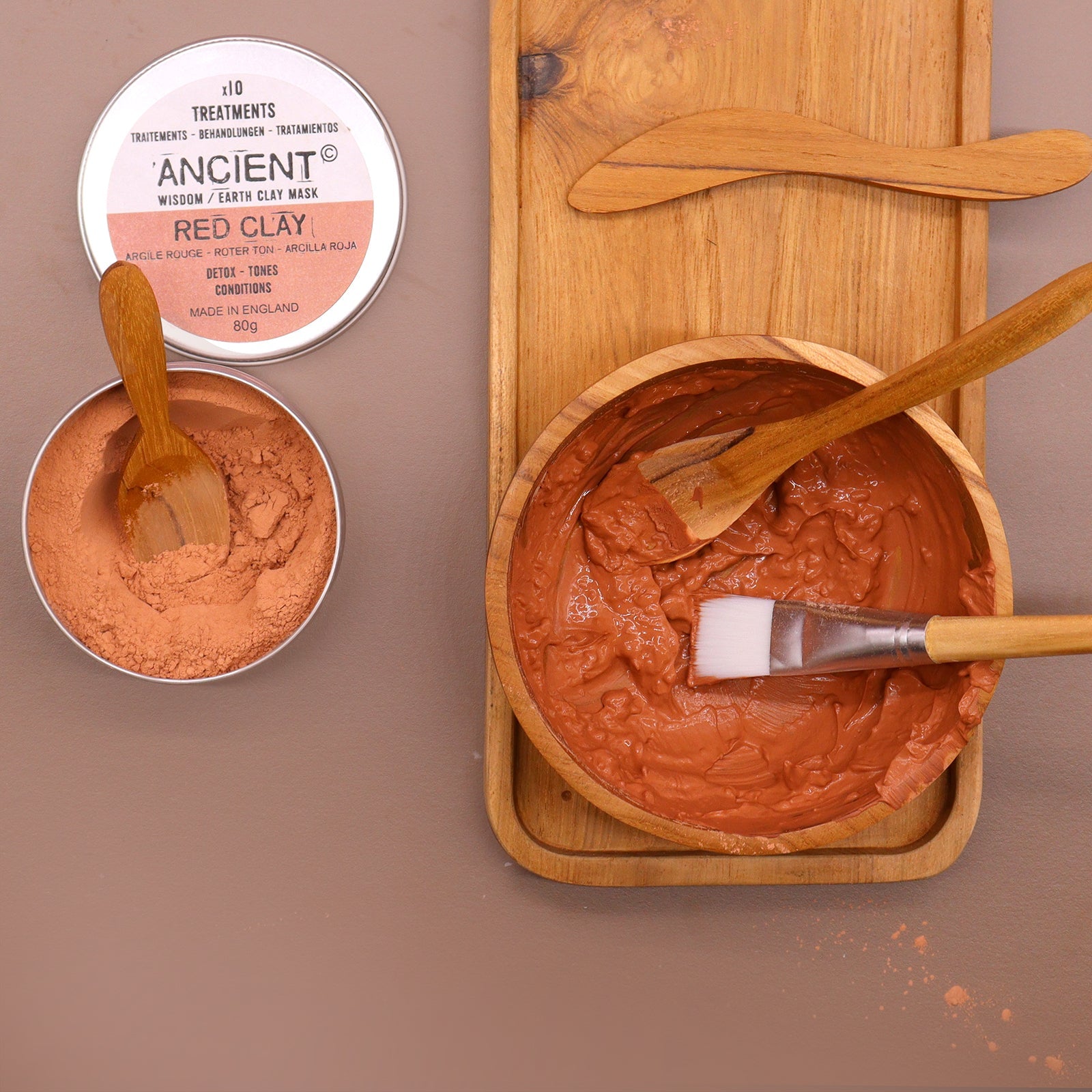 Handmade Teak Clay or Wax Spa Application Set with orange paste in a bowl, brush, applicators and two open tins by Quintessential Holistic Health Ltd