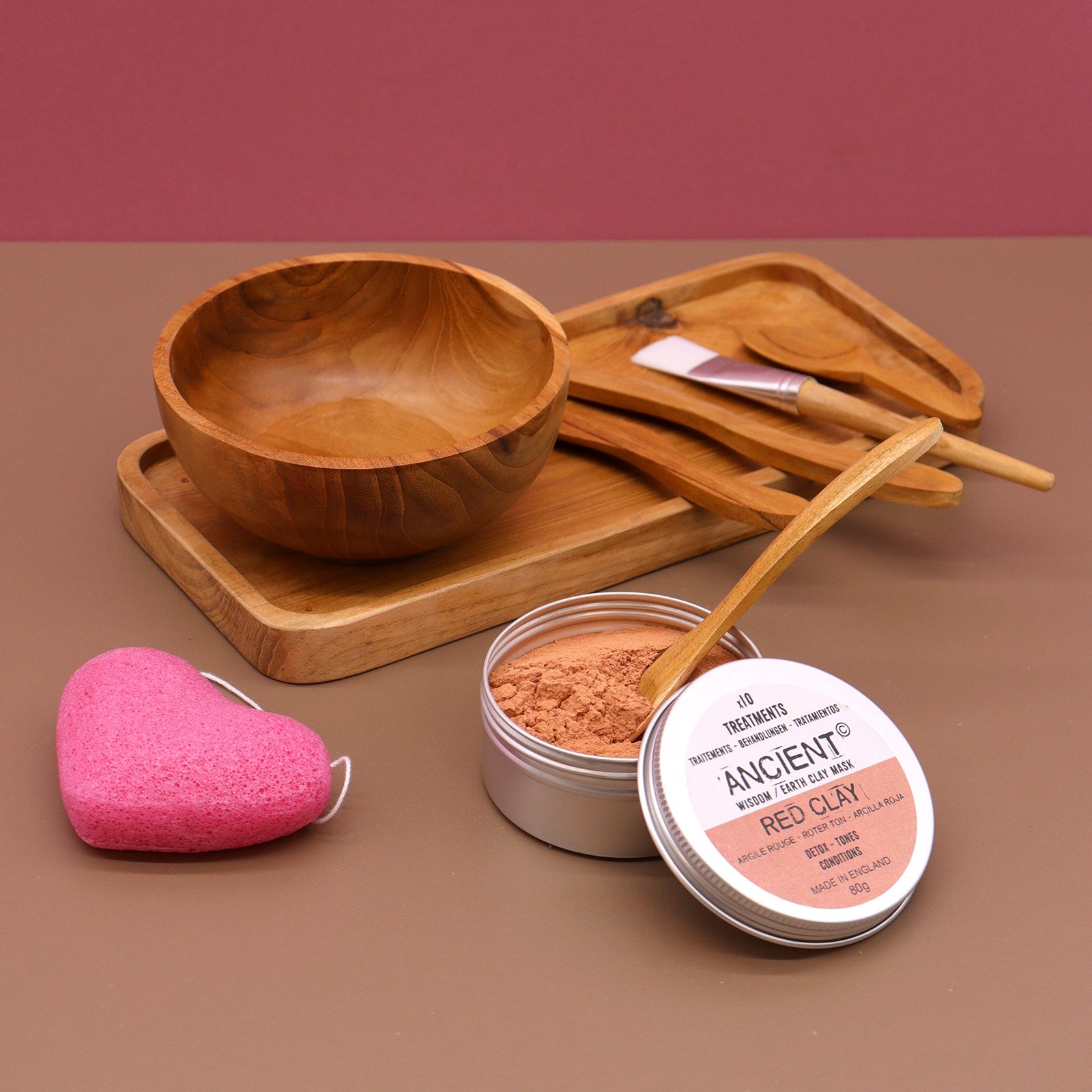 Handmade Teak Clay or Wax Spa Application Set with bowl and applicators beside two open tins and a pink sponge by Quintessential Holistic Health Ltd