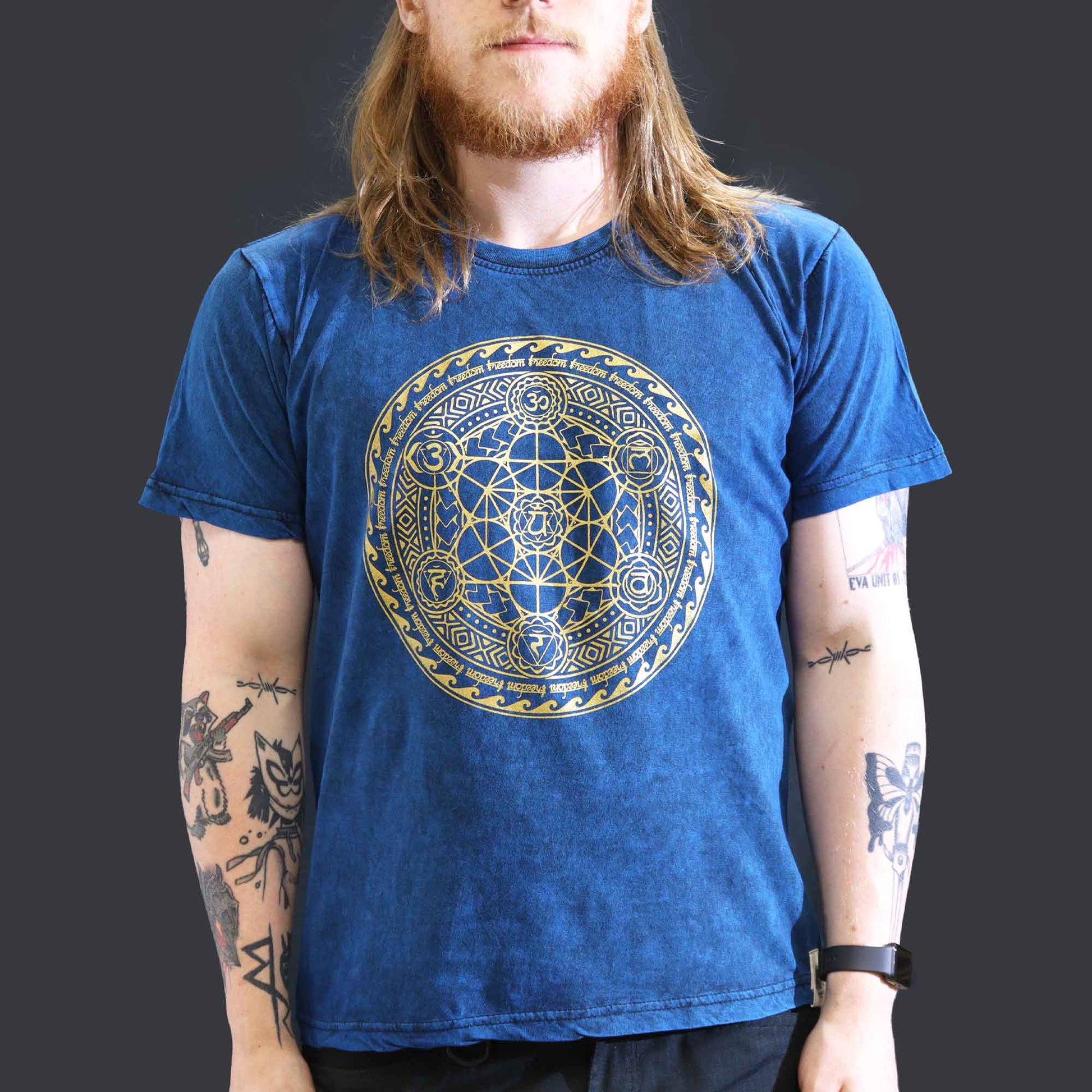 Nomad Sari Unisex Eco-Friendly 100% Cotton Stone Washed T-Shirt - Large / Unisex / Chakra / Blue product packaging on clean background from Quintessential Holistic Health Ltd