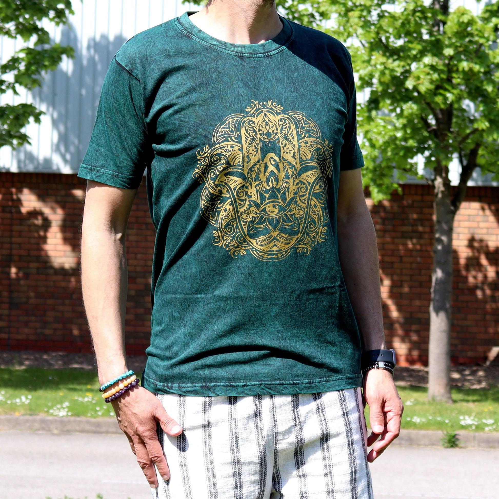 Nomad Sari Unisex Eco-Friendly 100% Cotton Stone Washed T-Shirt - Medium / Unisex / Hamsa / Green product packaging on clean background from Quintessential Holistic Health Ltd