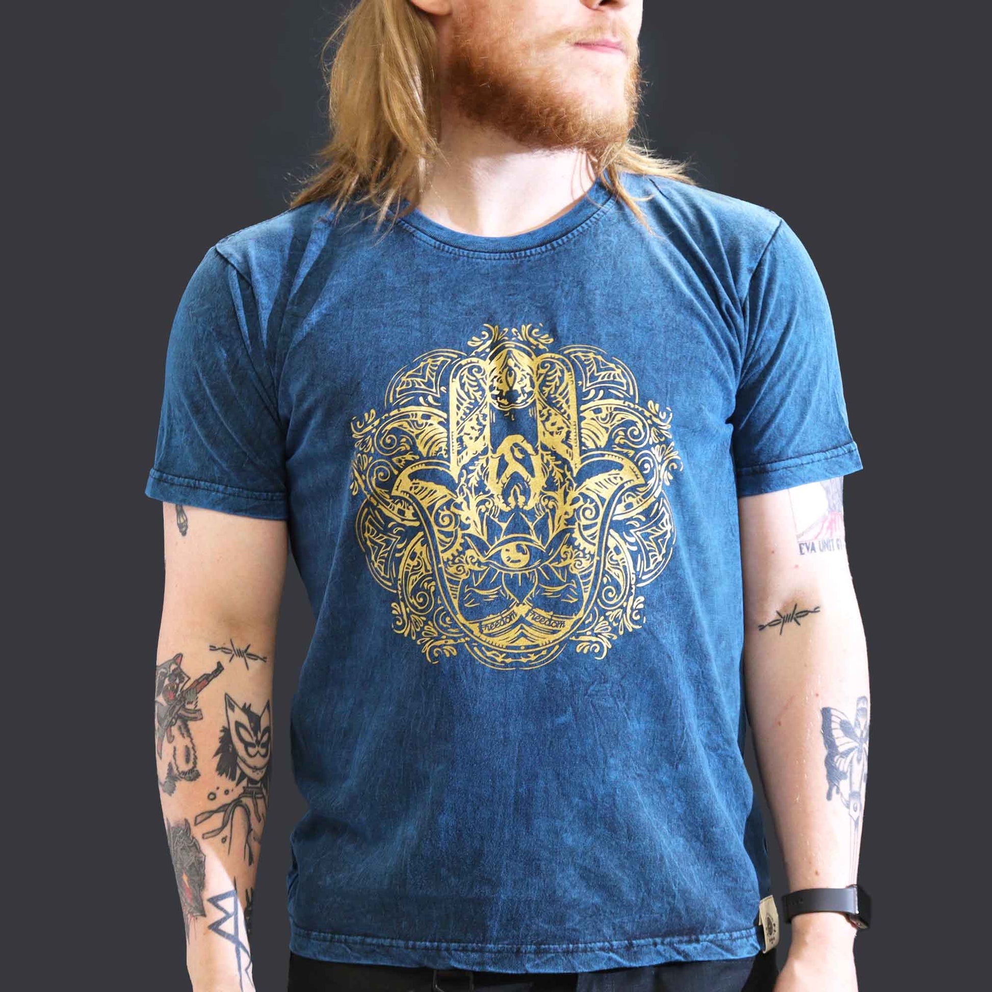 Nomad Sari Unisex Eco-Friendly 100% Cotton Stone Washed T-Shirt - Large / Unisex / Hamsa / Blue product packaging on clean background from Quintessential Holistic Health Ltd
