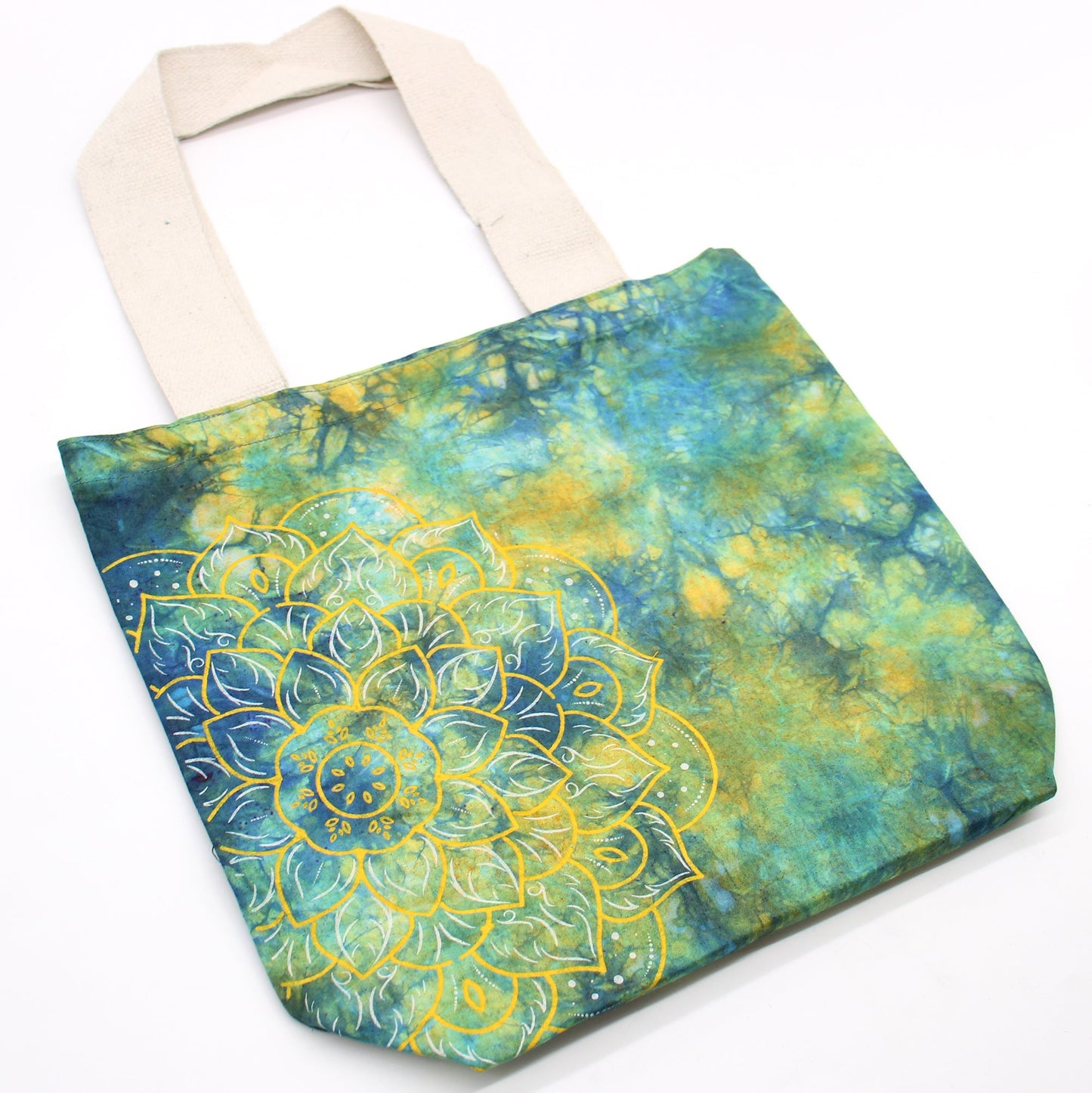 Tie-Dyed Cotton Tote Bag - Mandala - Green and Blue with mottled teal colouring and an ornate yellow mandala across one side by Quintessential Holistic Health Ltd
