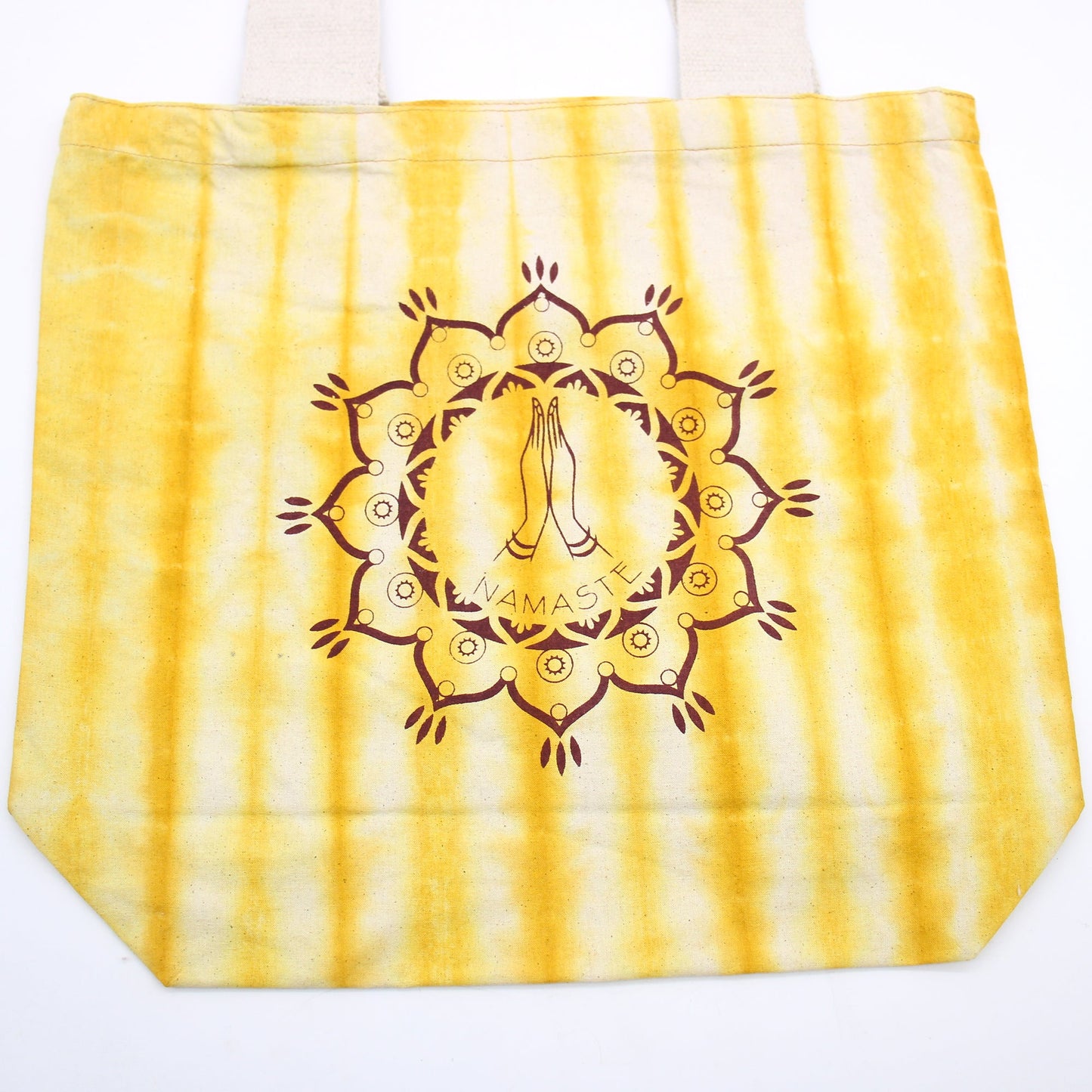 Tie-Dyed Cotton Tote Bag - Namaste Hands - Yellow with vertical yellow stripes and a detailed central praying-hands mandala by Quintessential Holistic Health Ltd