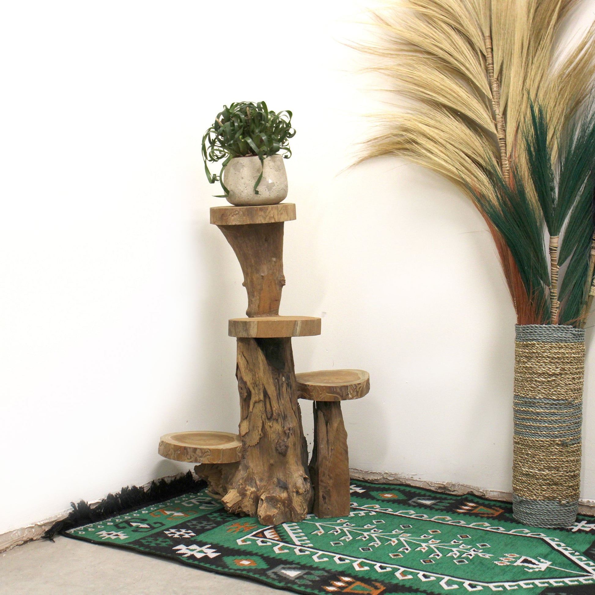 Eco-Friendly Teak 4-Tier Plant and Display Stand - Natural with staggered platforms, one holding a potted plant by Quintessential Holistic Health Ltd