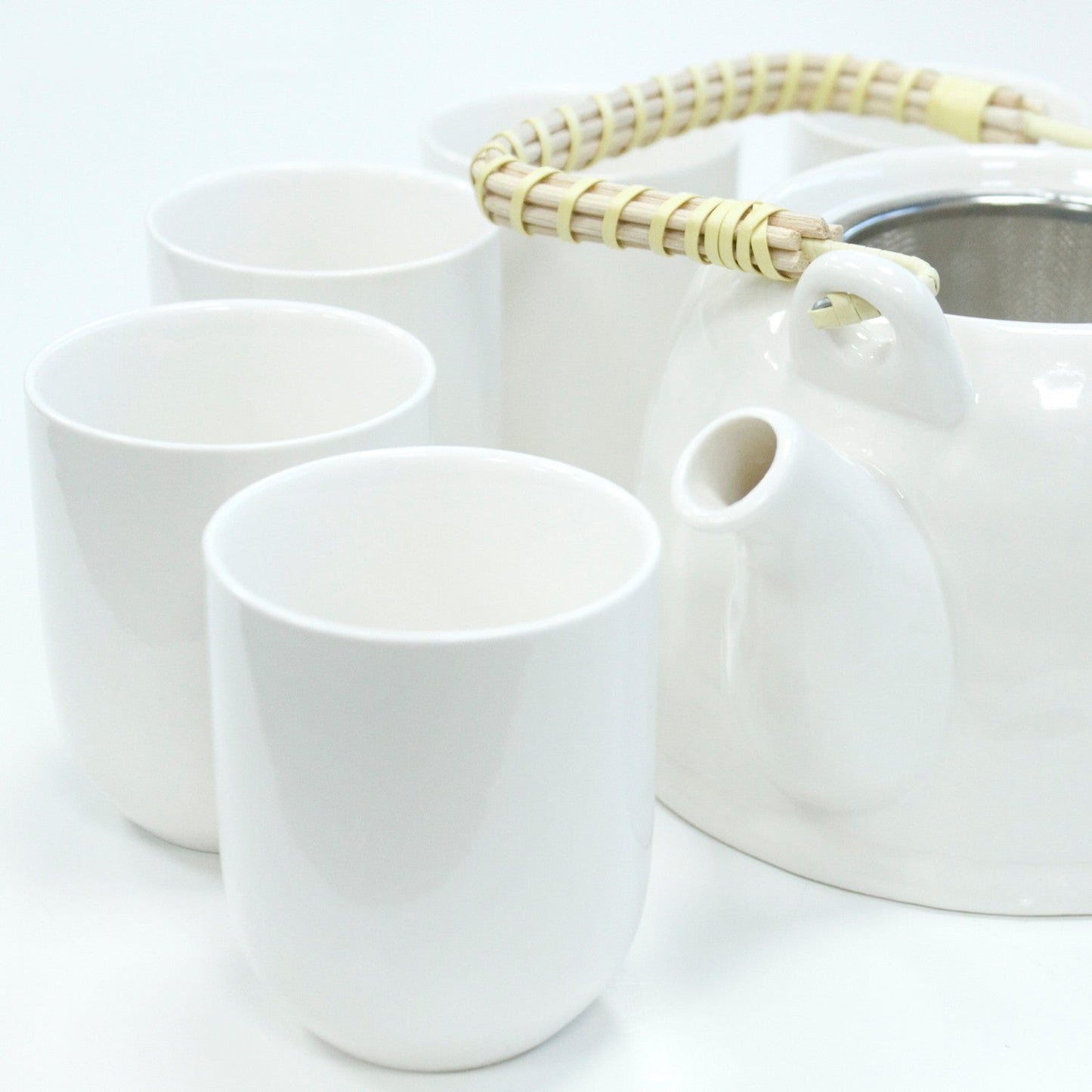 650ml Classic Design White Glazed Ceramic Herbal Teapot with a Strainer and a 6 Matching Cup Set product packaging on clean background from Quintessential Holistic Health Ltd
